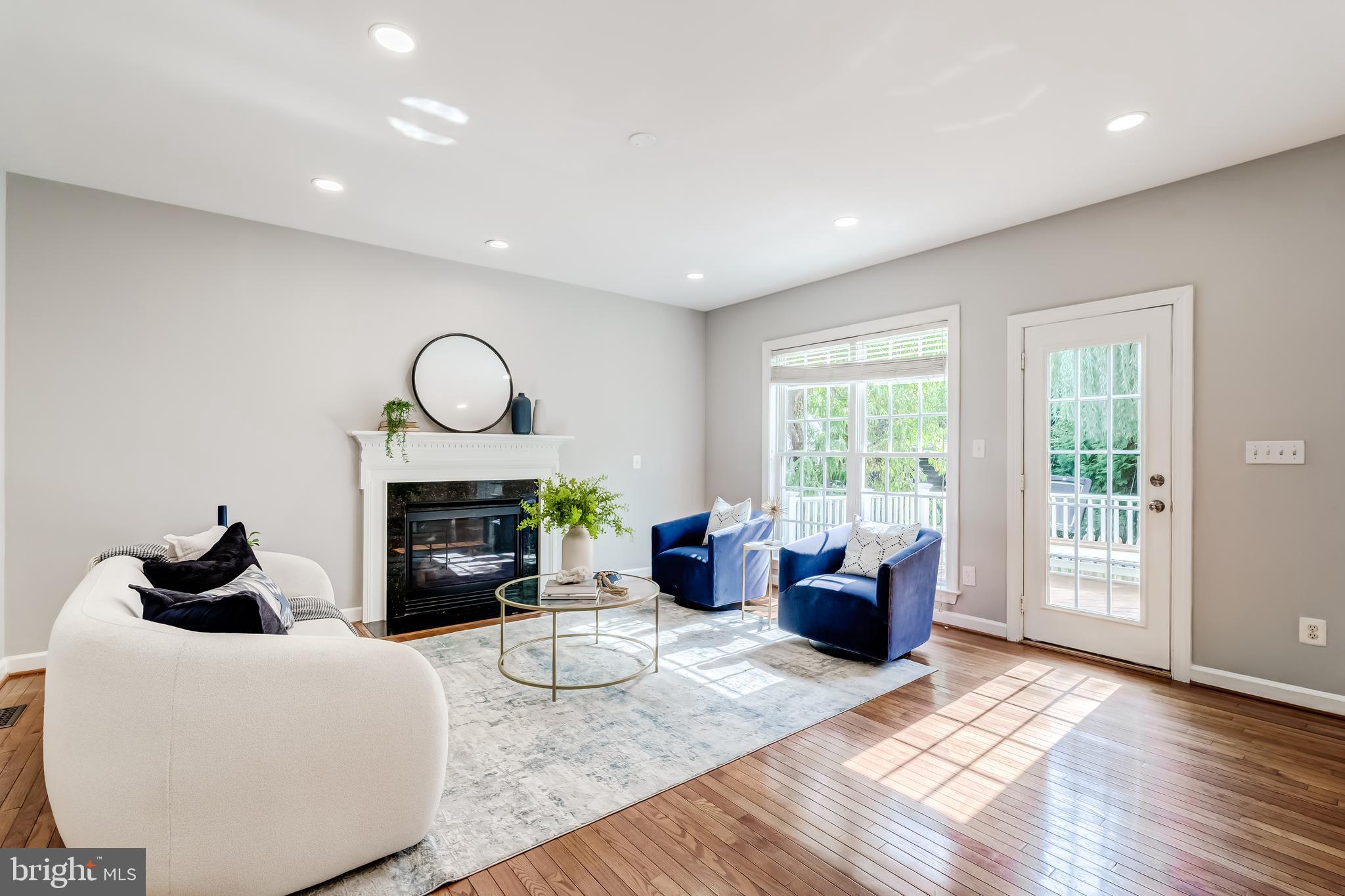19111 Chartier Drive Leesburg, VA 20176 - Photo 18 of 68 a living room with furniture a fireplace and a window