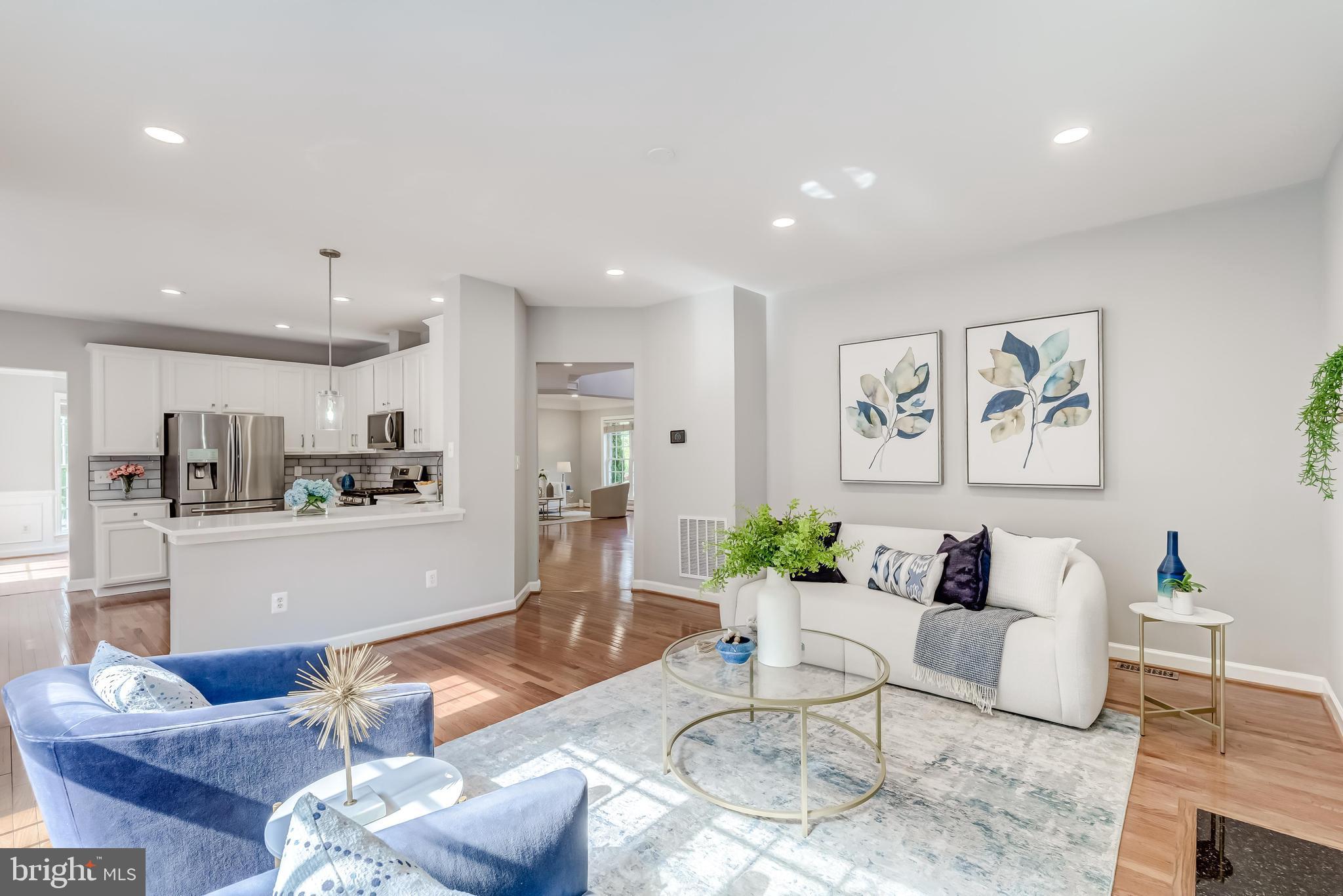 19111 Chartier Drive Leesburg, VA 20176 - Photo 2 of 68 a living room with furniture kitchen and a table