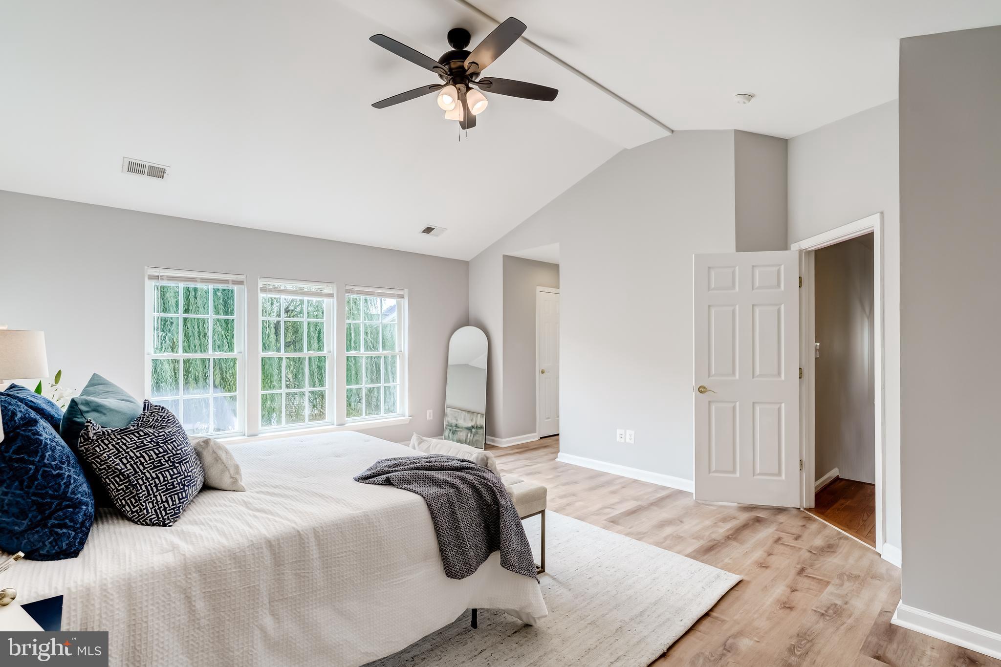 19111 Chartier Drive Leesburg, VA 20176 - Photo 22 of 68 a bedroom with a bed and a large window
