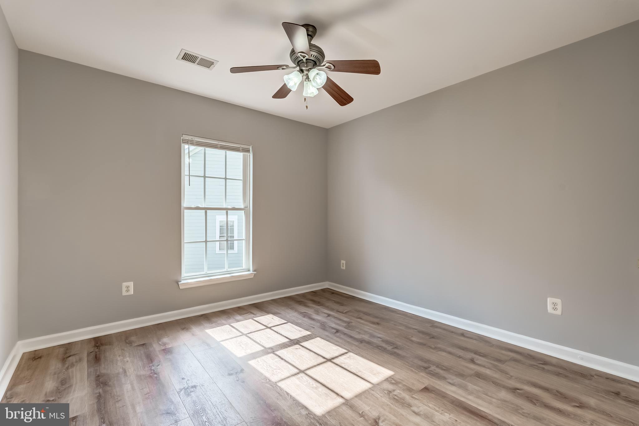 19111 Chartier Drive Leesburg, VA 20176 - Photo 30 of 68 wooden floor in an empty room with a window