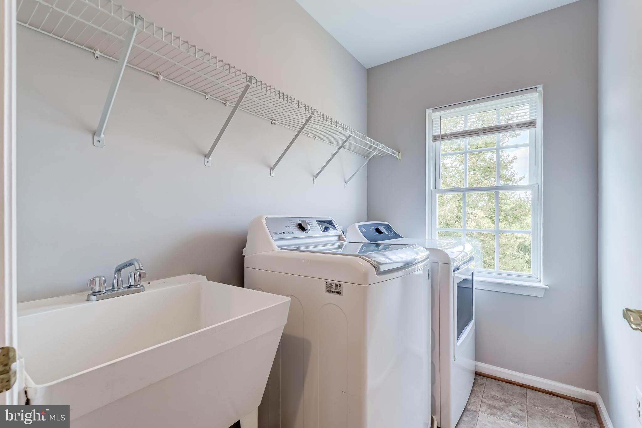 19111 Chartier Drive Leesburg, VA 20176 - Photo 35 of 68 a utility room with dryer and washer