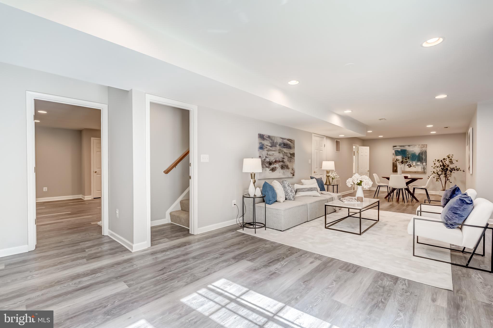 19111 Chartier Drive Leesburg, VA 20176 - Photo 36 of 68 a living room with furniture and a wooden floor