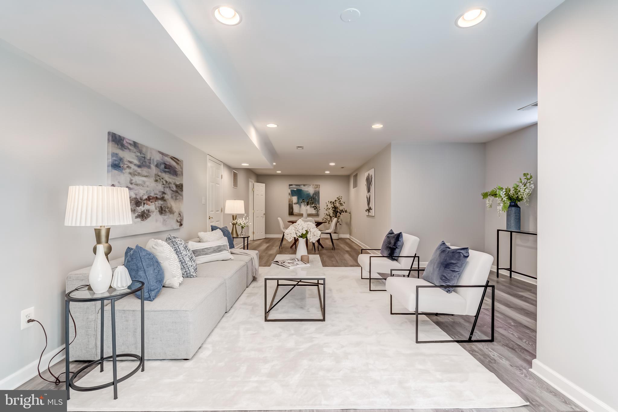 19111 Chartier Drive Leesburg, VA 20176 - Photo 37 of 68 a living room with furniture and a potted plant