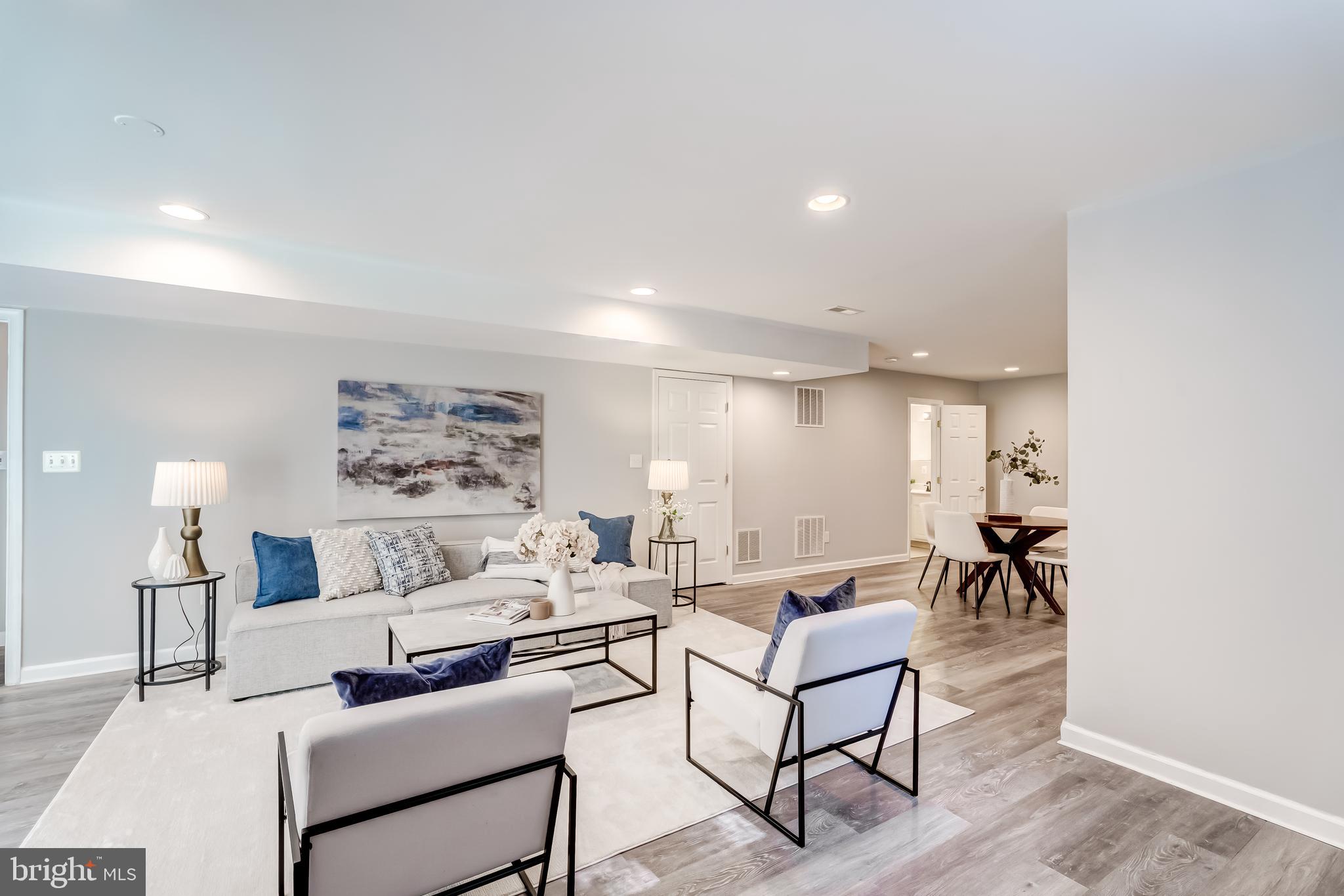 19111 Chartier Drive Leesburg, VA 20176 - Photo 38 of 68 a living room with furniture and a table
