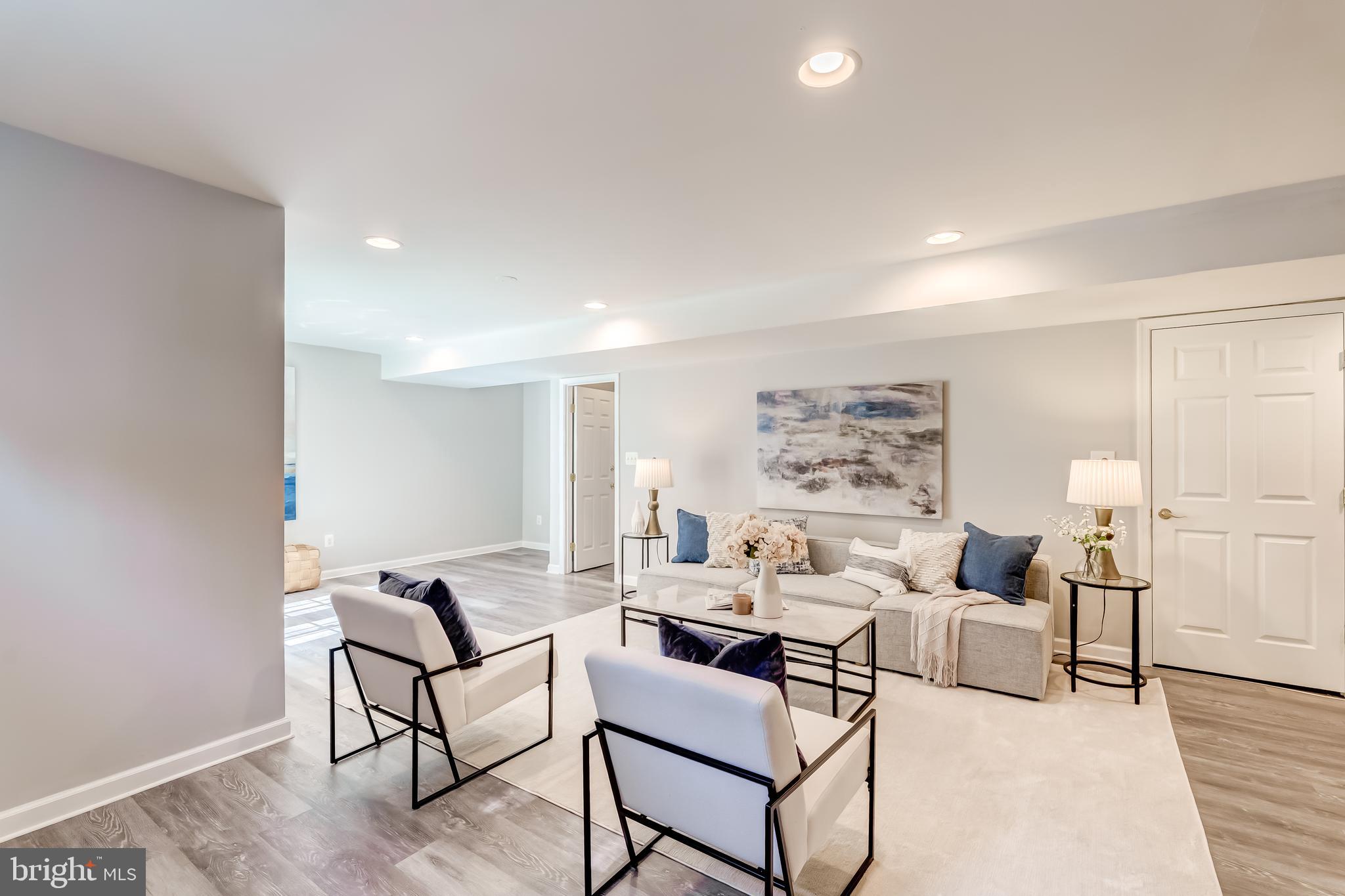 19111 Chartier Drive Leesburg, VA 20176 - Photo 40 of 68 a living room with furniture and a table