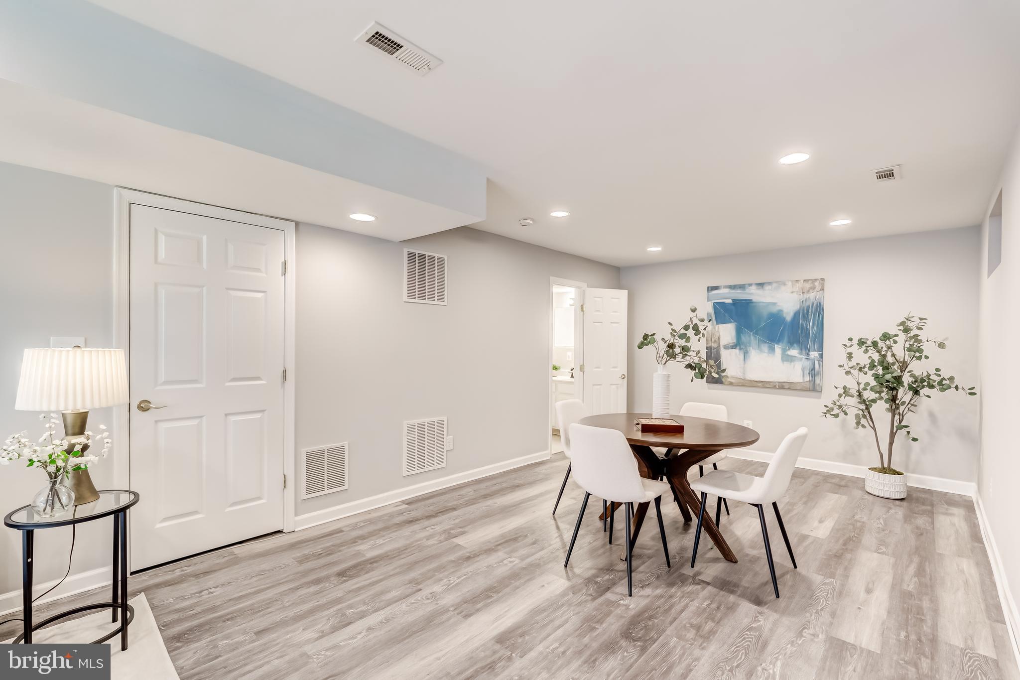 19111 Chartier Drive Leesburg, VA 20176 - Photo 41 of 68 a view of a dining room with furniture and wooden floor