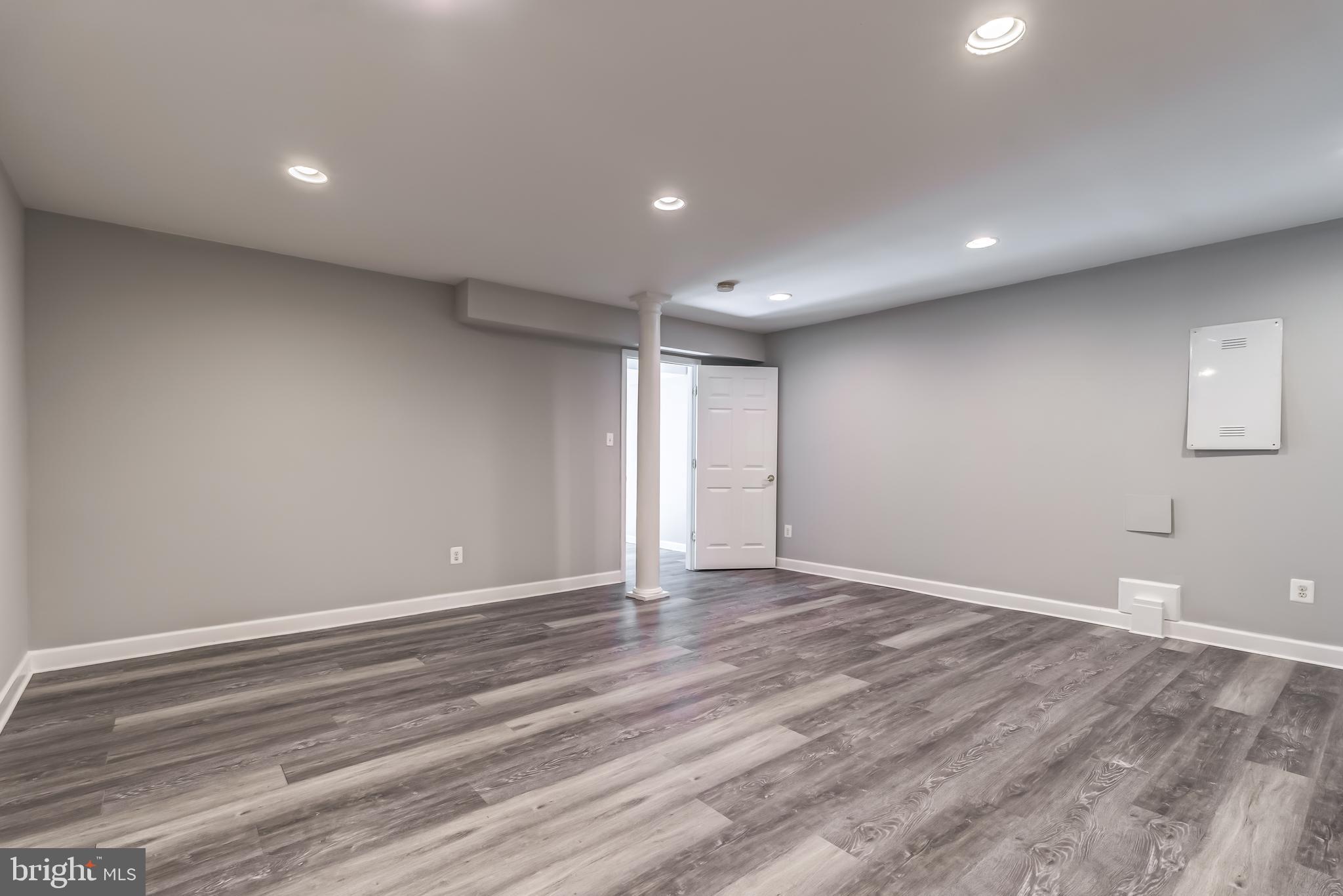 19111 Chartier Drive Leesburg, VA 20176 - Photo 44 of 68 a view of an empty room with wooden floor