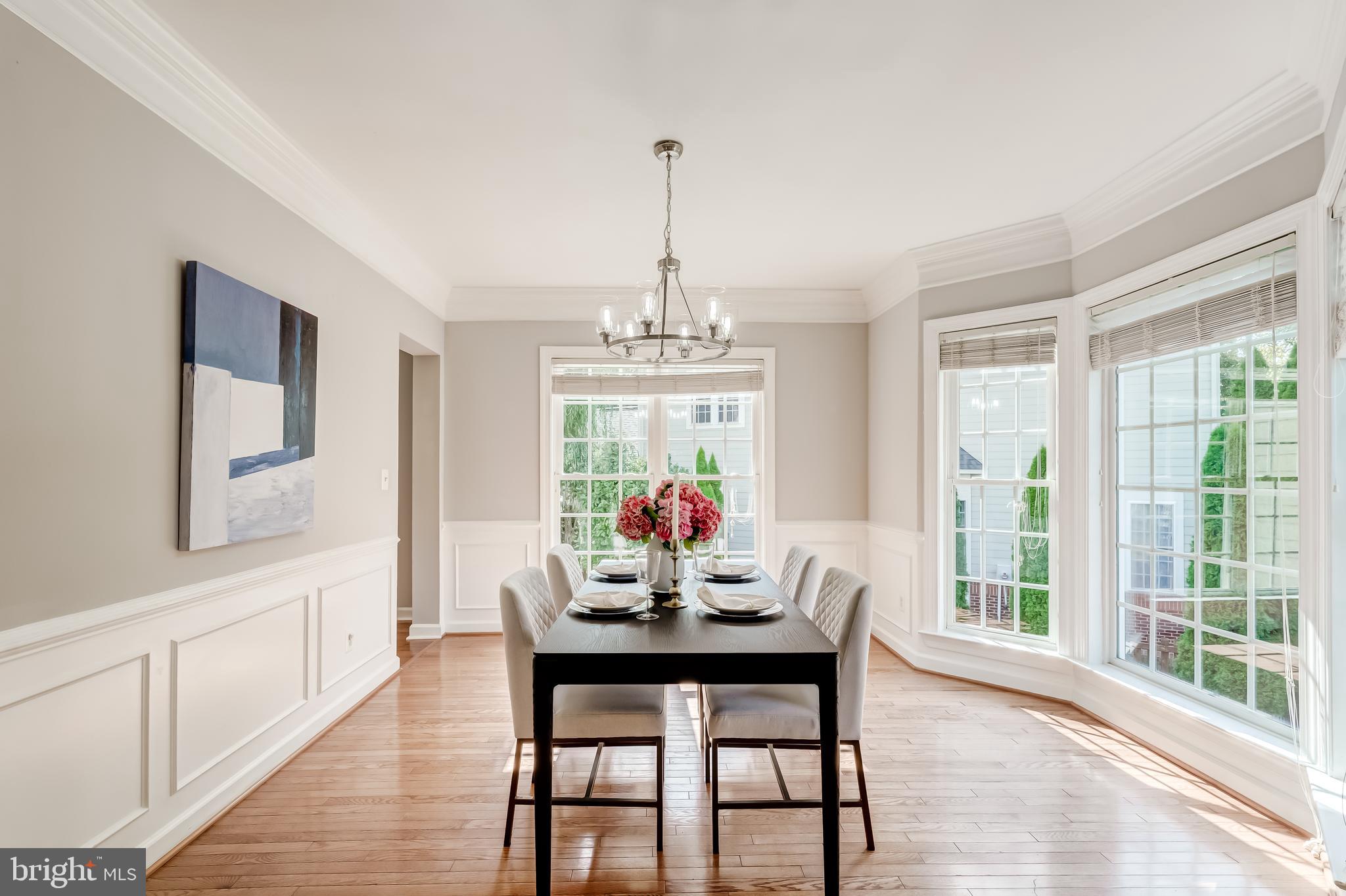 19111 Chartier Drive Leesburg, VA 20176 - Photo 6 of 68 a dining room with furniture a chandelier and wooden floor