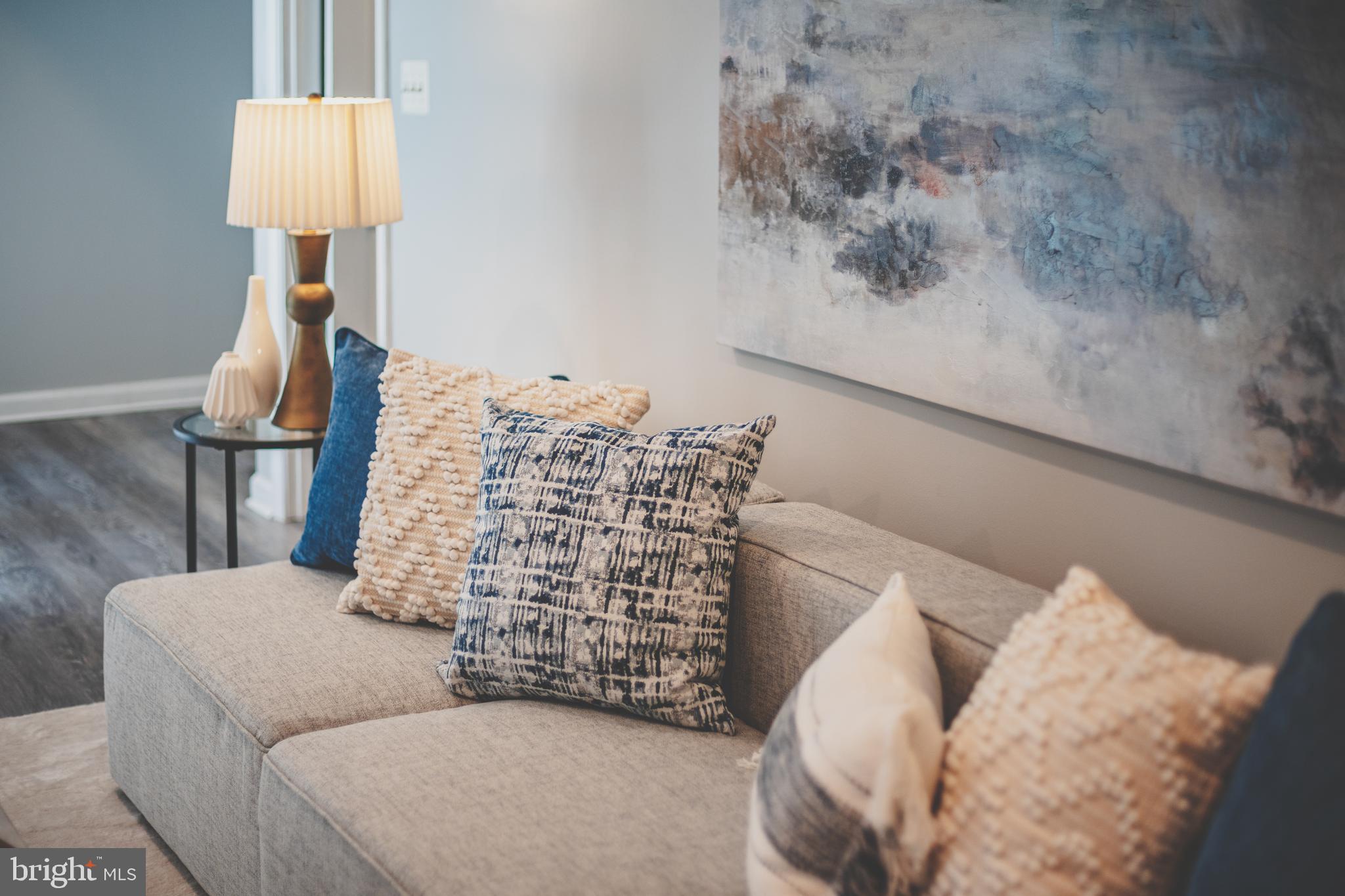 19111 Chartier Drive Leesburg, VA 20176 - Photo 64 of 68 a bedroom with a bed and a lamp on table