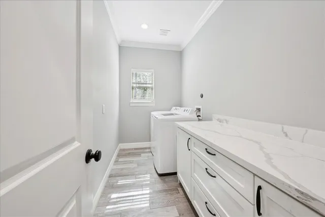 a spacious bathroom with a double vanity sink a mirror and a bathtub