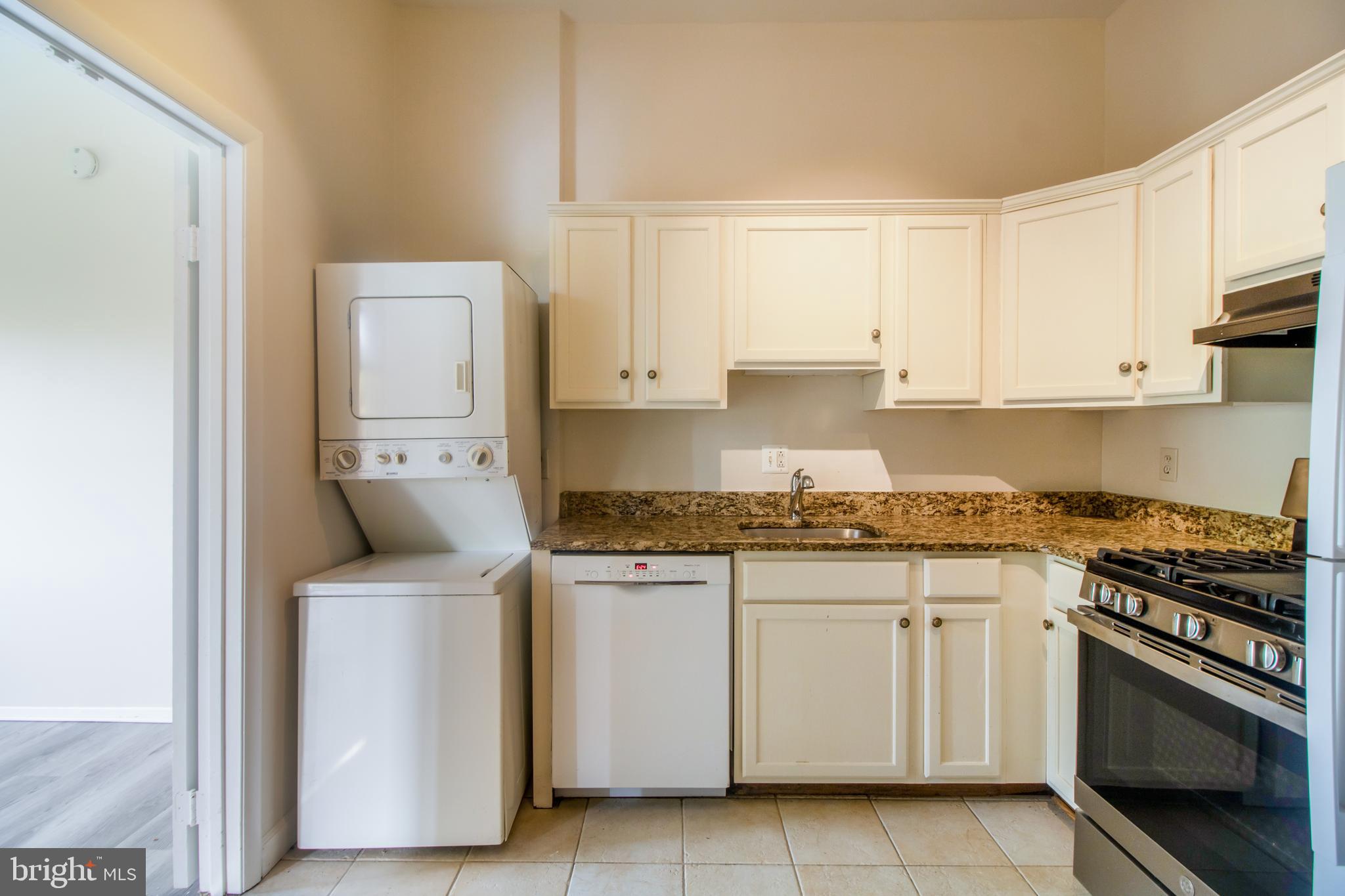 18730 Walkers Choice Road, Unit 2 Montgomery Village, MD 20886 - Photo 12 of 47 Main Level- White kitchen with granite countertops