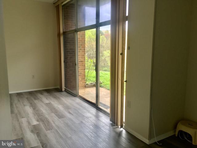 18730 Walkers Choice Road, Unit 2 Montgomery Village, MD 20886 - Photo 9 of 47 Living/ Dining with Patio