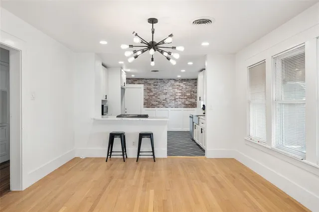 a kitchen with a sink a stove a refrigerator and cabinets