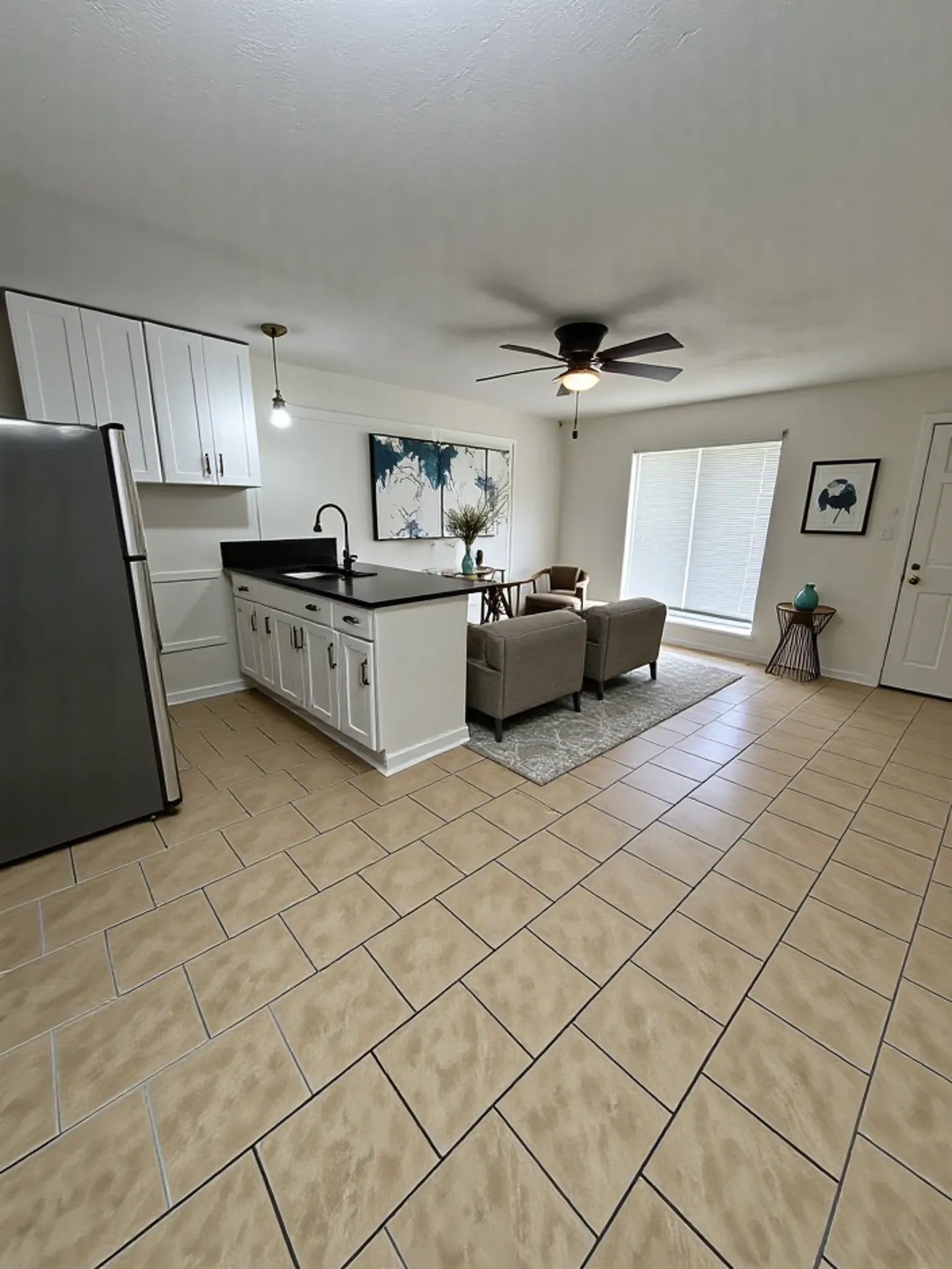 7610 Red Robin Lane Houston, TX 77075 - Photo 11 of 21 Unit 2 Living Space to Kitchen Staged;