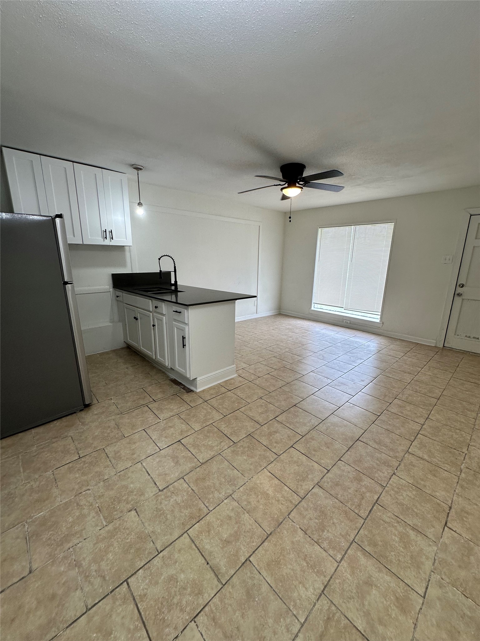 7610 Red Robin Lane Houston, TX 77075 - Photo 10 of 21 Unit 2 View of living space to kitchen;