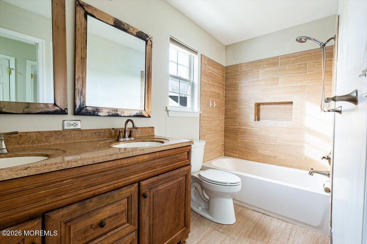 10 Hemingway Lane Columbus, NJ 08022 - Photo 15 of 50 a bathroom with a granite countertop sink a toilet and shower