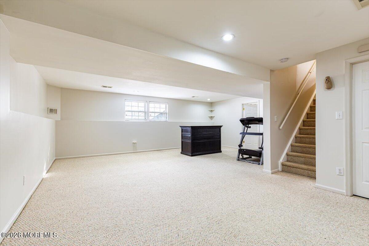 10 Hemingway Lane Columbus, NJ 08022 - Photo 38 of 50 an empty room with fireplace and stairs