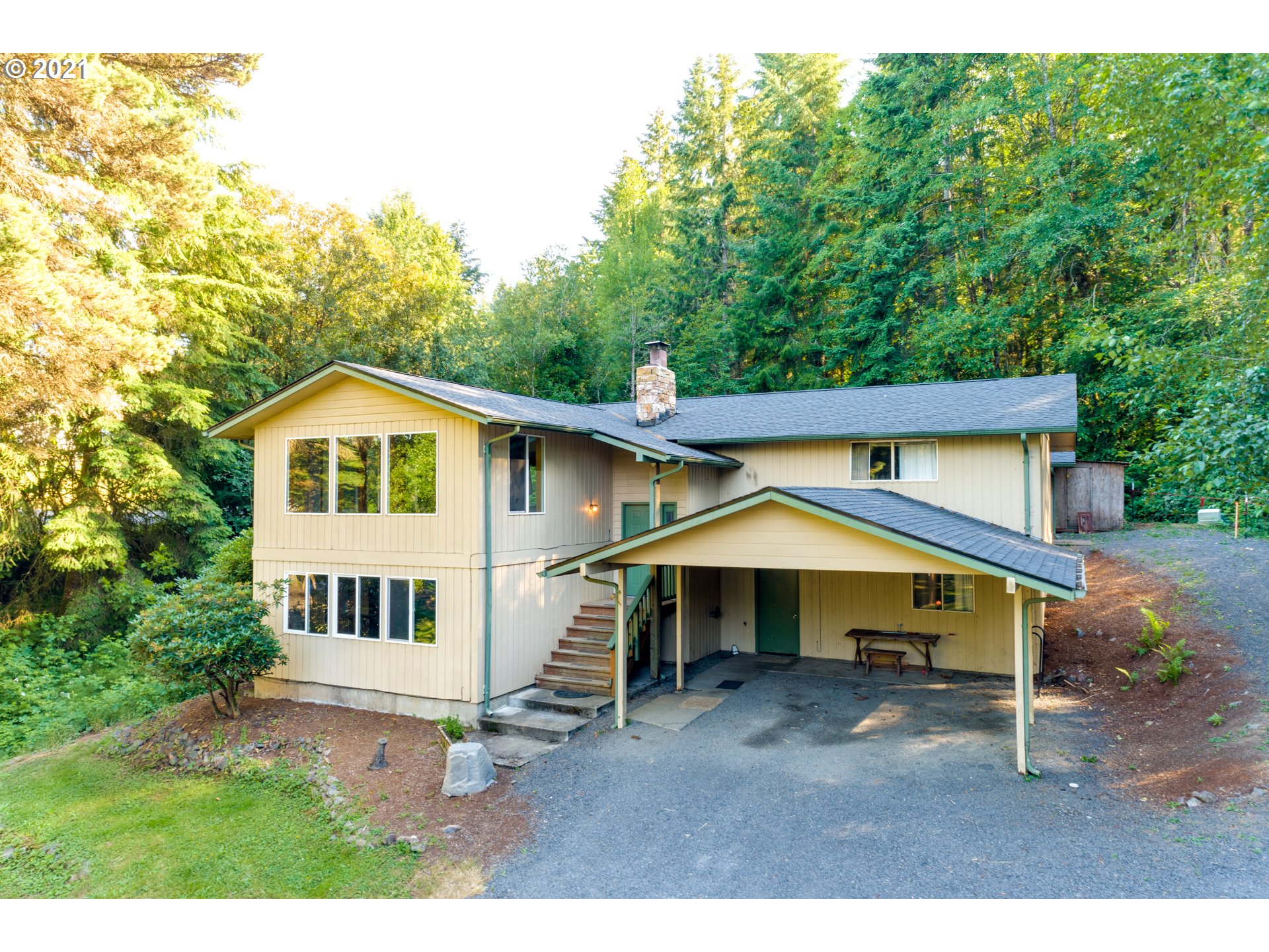 531 Oak Point Road Longview, WA 98632 - Photo 1 of 29 a view of house with wooden fence and a yard
