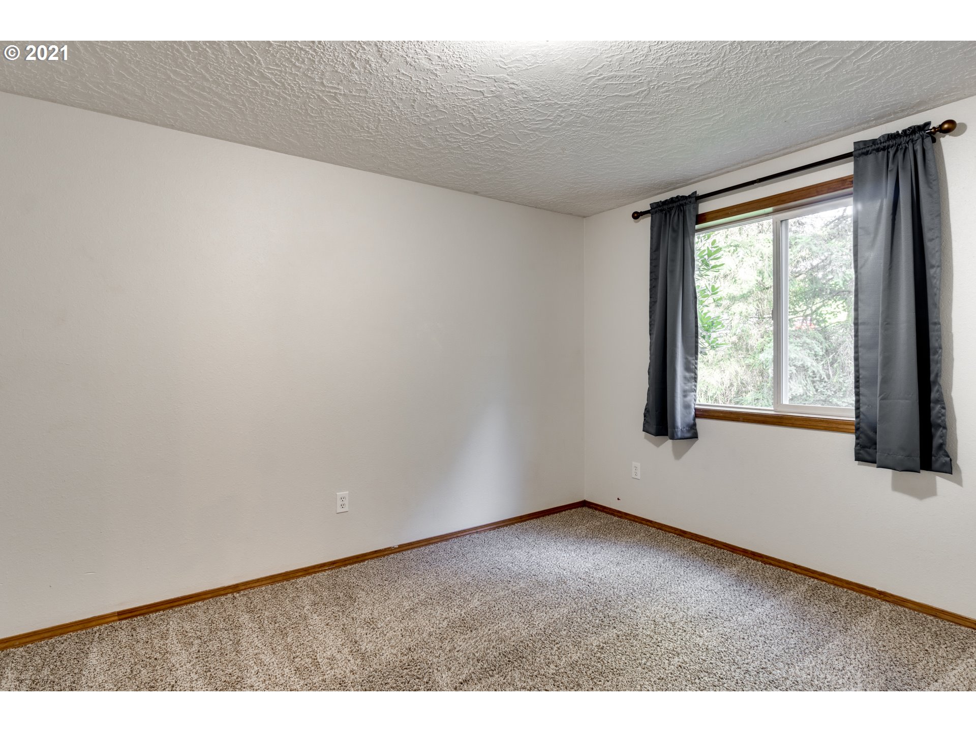 531 Oak Point Road Longview, WA 98632 - Photo 22 of 29 a view of an empty room with a window