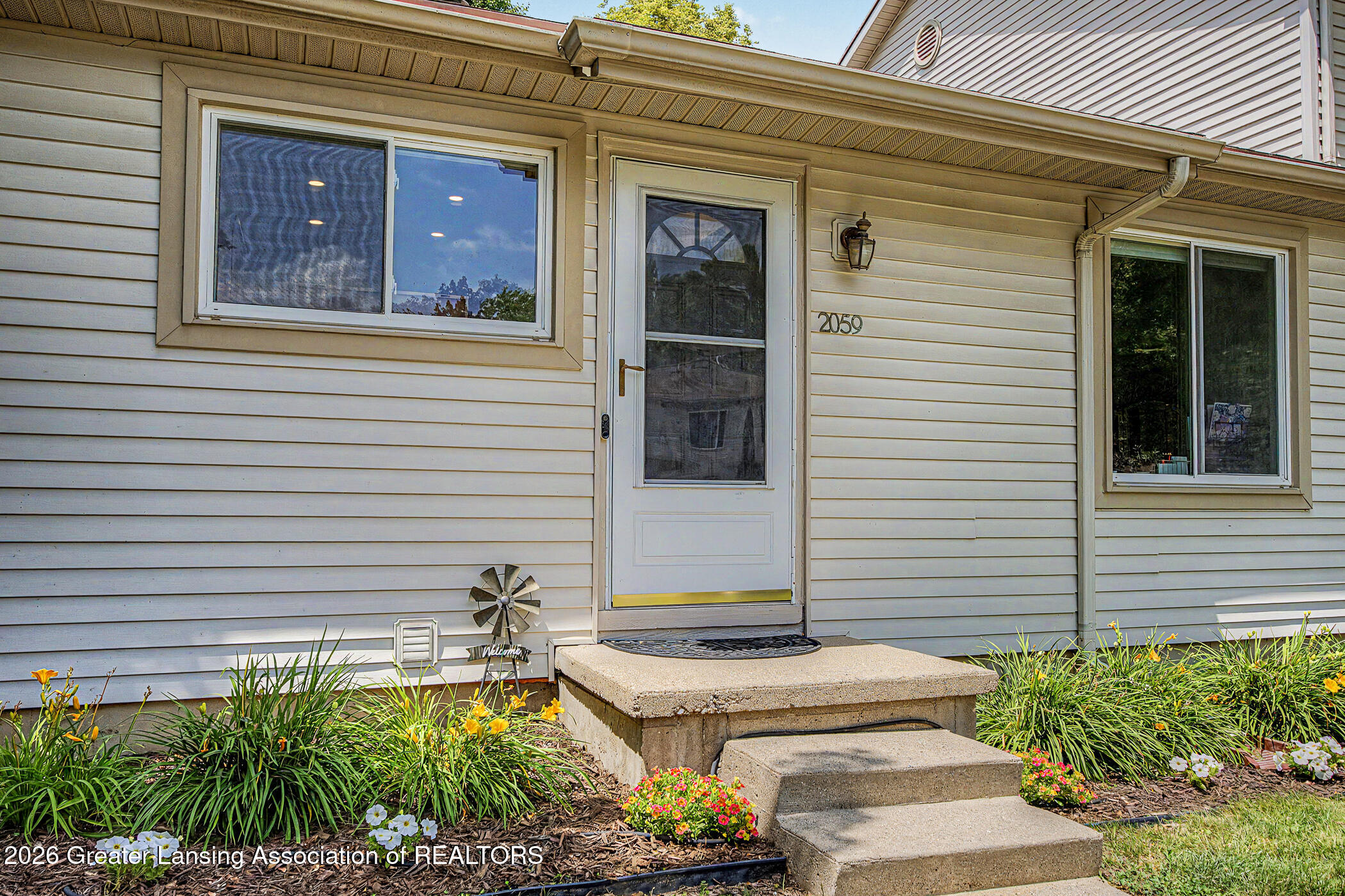 2059 La Mer Lane, Unit 17 Haslett, MI 48840 - Photo 3 of 48 Front Door