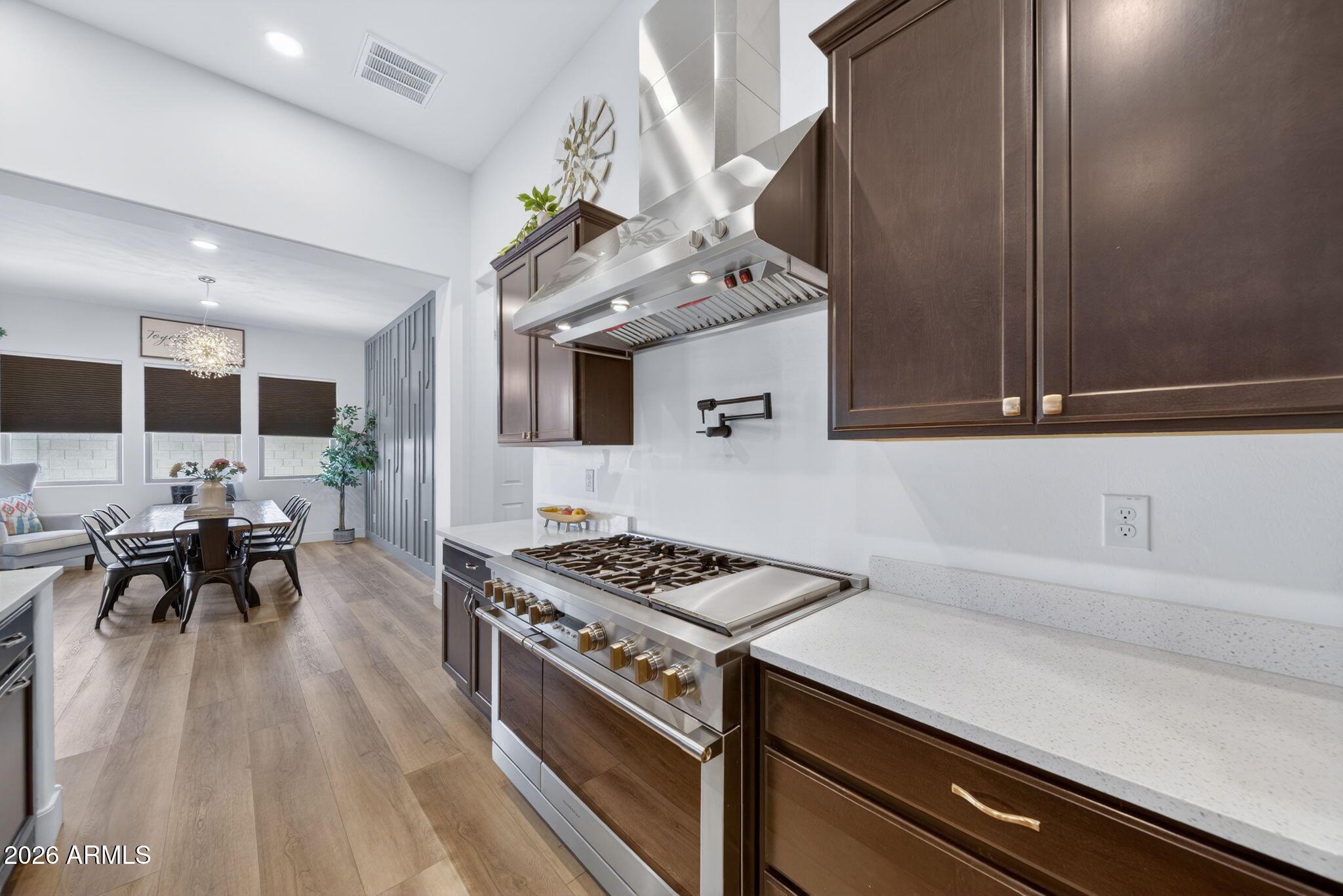 9932 East Rotation Drive Mesa, AZ 85212 - Photo 11 of 62 a kitchen with granite countertop a sink stove and cabinets