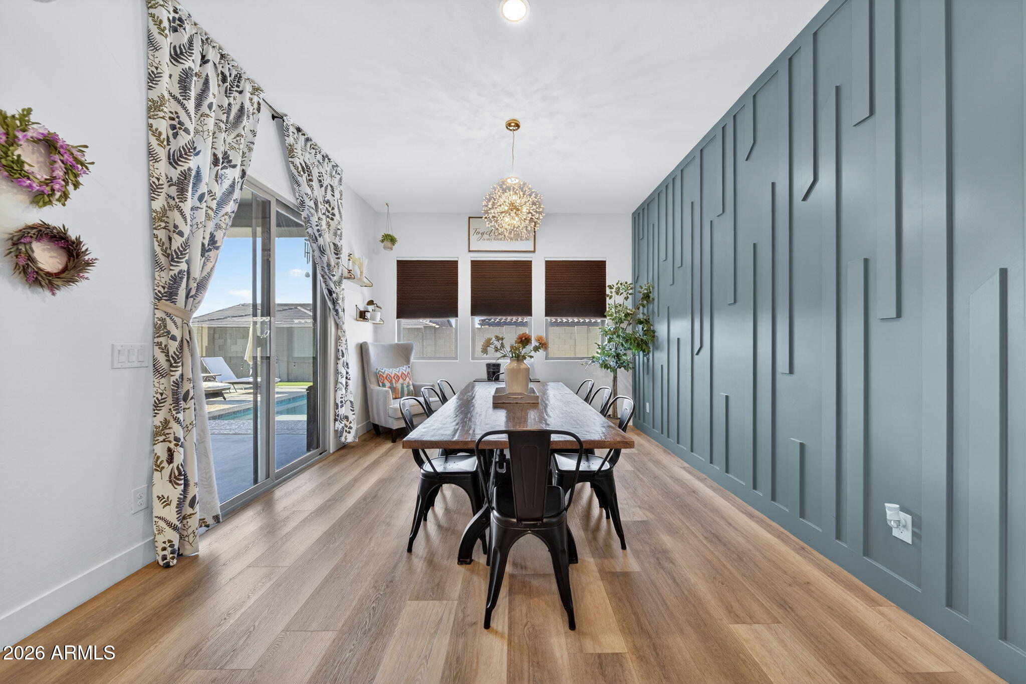 9932 East Rotation Drive Mesa, AZ 85212 - Photo 12 of 62 a dining room with furniture and wooden floor