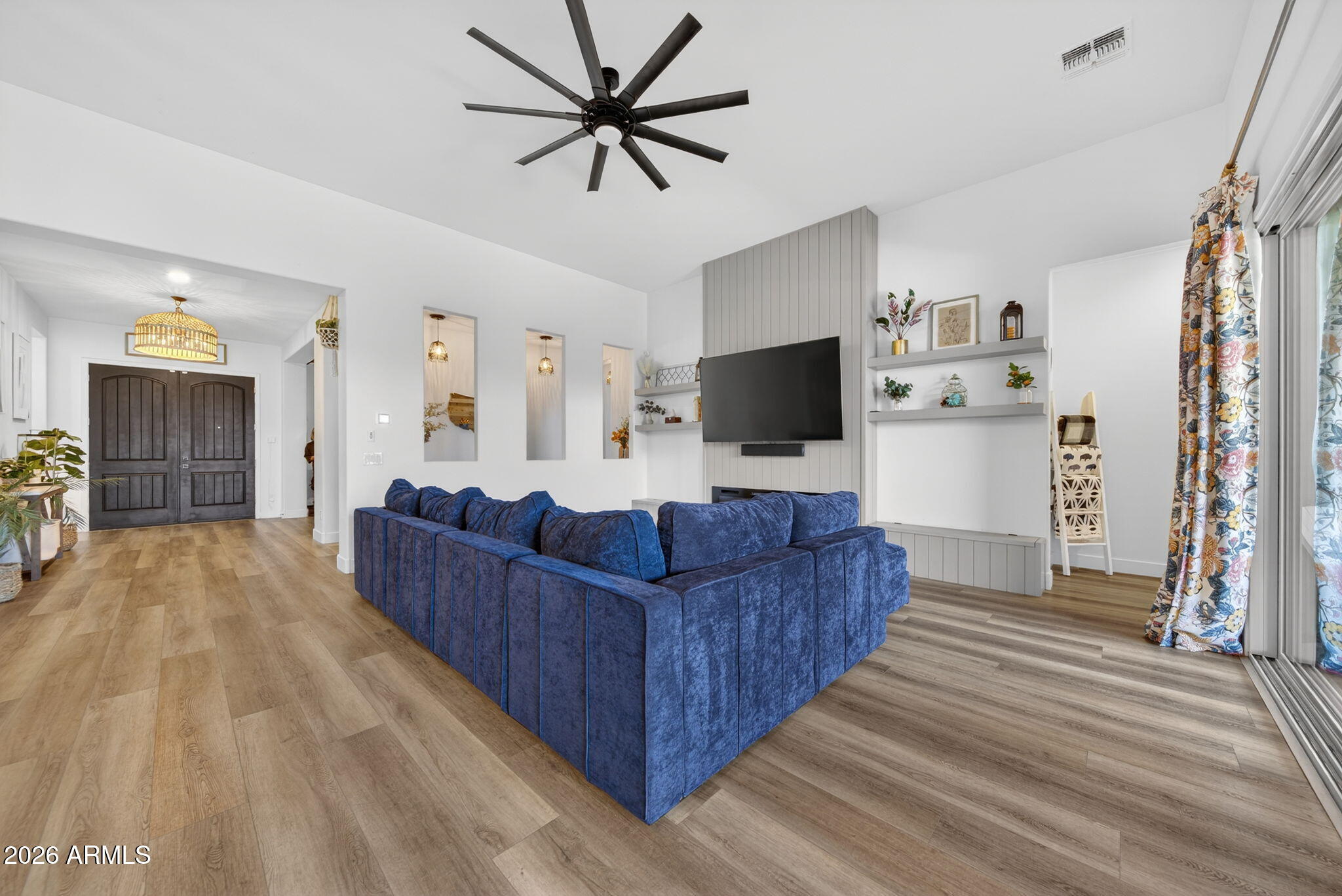 9932 East Rotation Drive Mesa, AZ 85212 - Photo 14 of 62 a living room with furniture and a flat screen tv