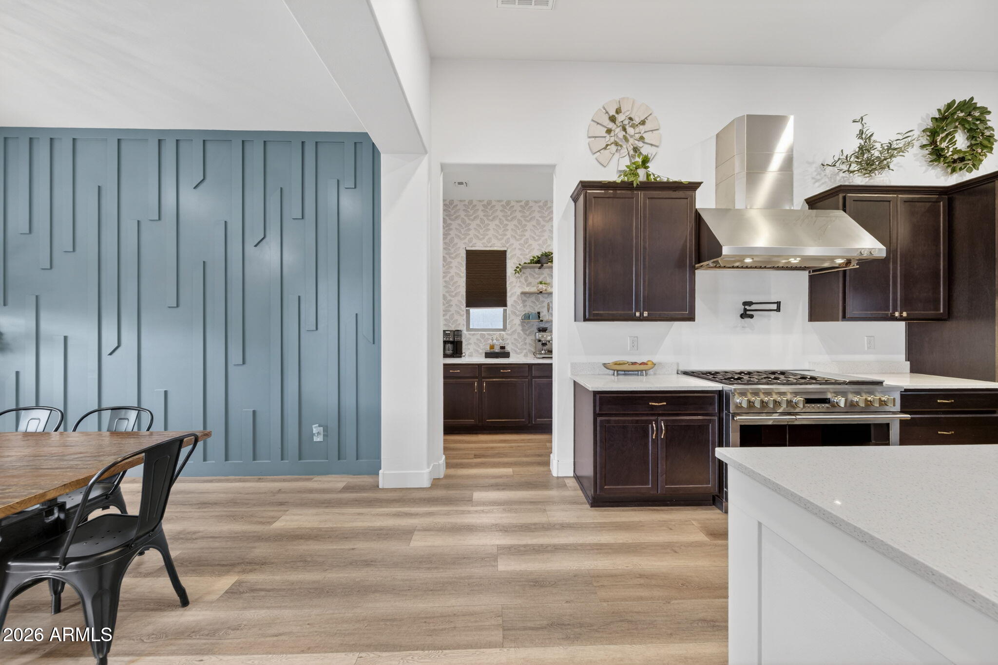 9932 East Rotation Drive Mesa, AZ 85212 - Photo 19 of 62 a kitchen with stainless steel appliances granite countertop a stove and a refrigerator