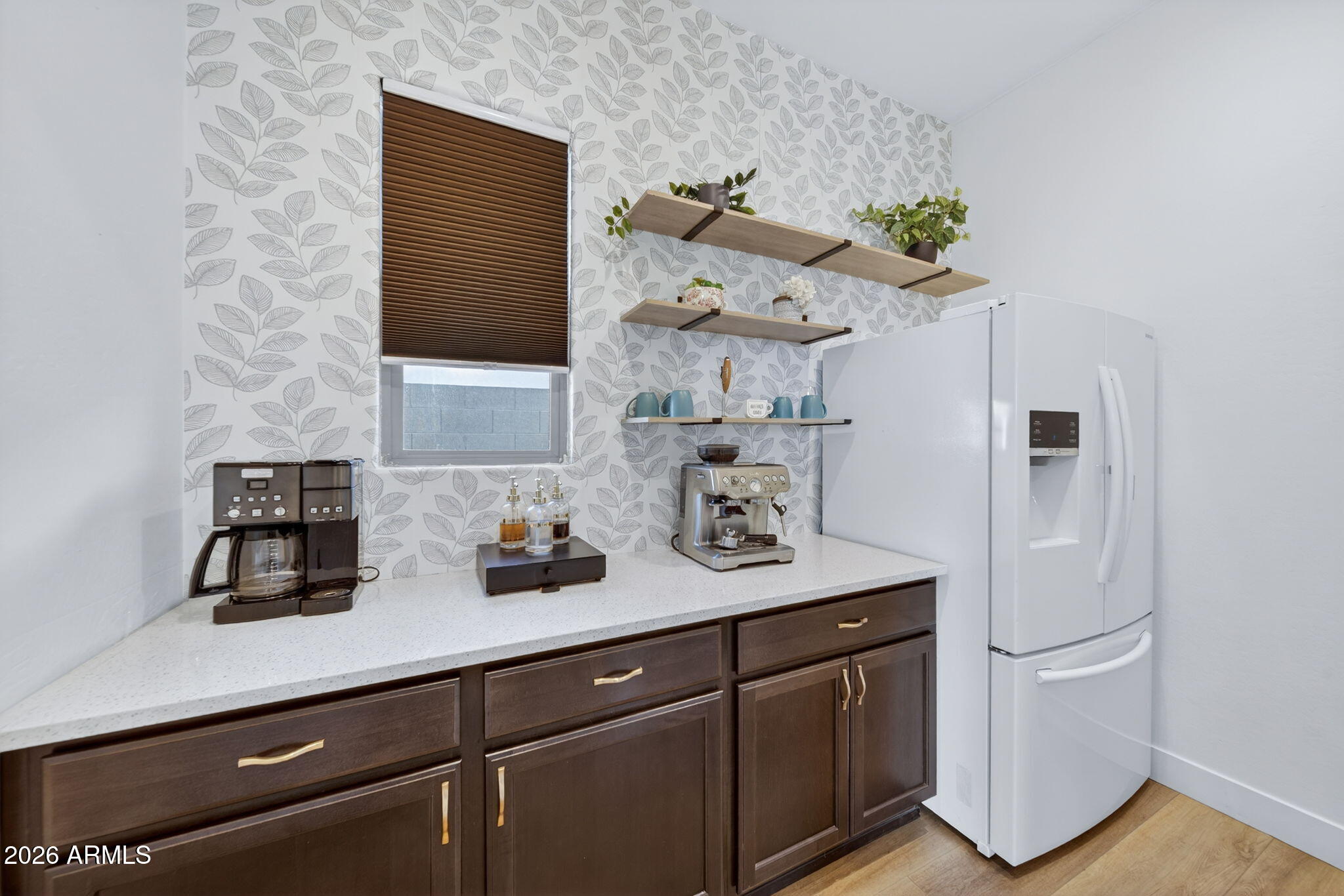 9932 East Rotation Drive Mesa, AZ 85212 - Photo 20 of 62 a kitchen with stainless steel appliances a sink a refrigerator and cabinets