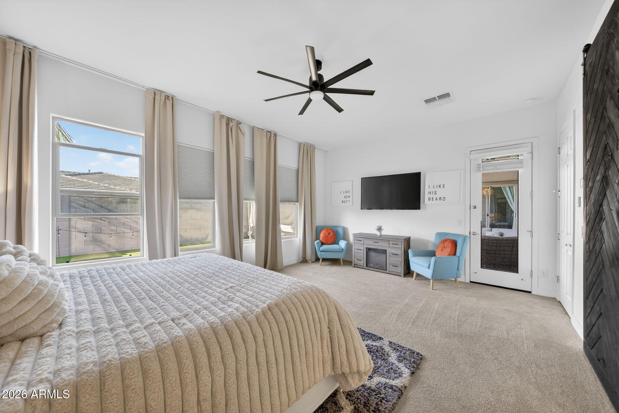 9932 East Rotation Drive Mesa, AZ 85212 - Photo 24 of 62 a bedroom with a bed window and a flat screen tv