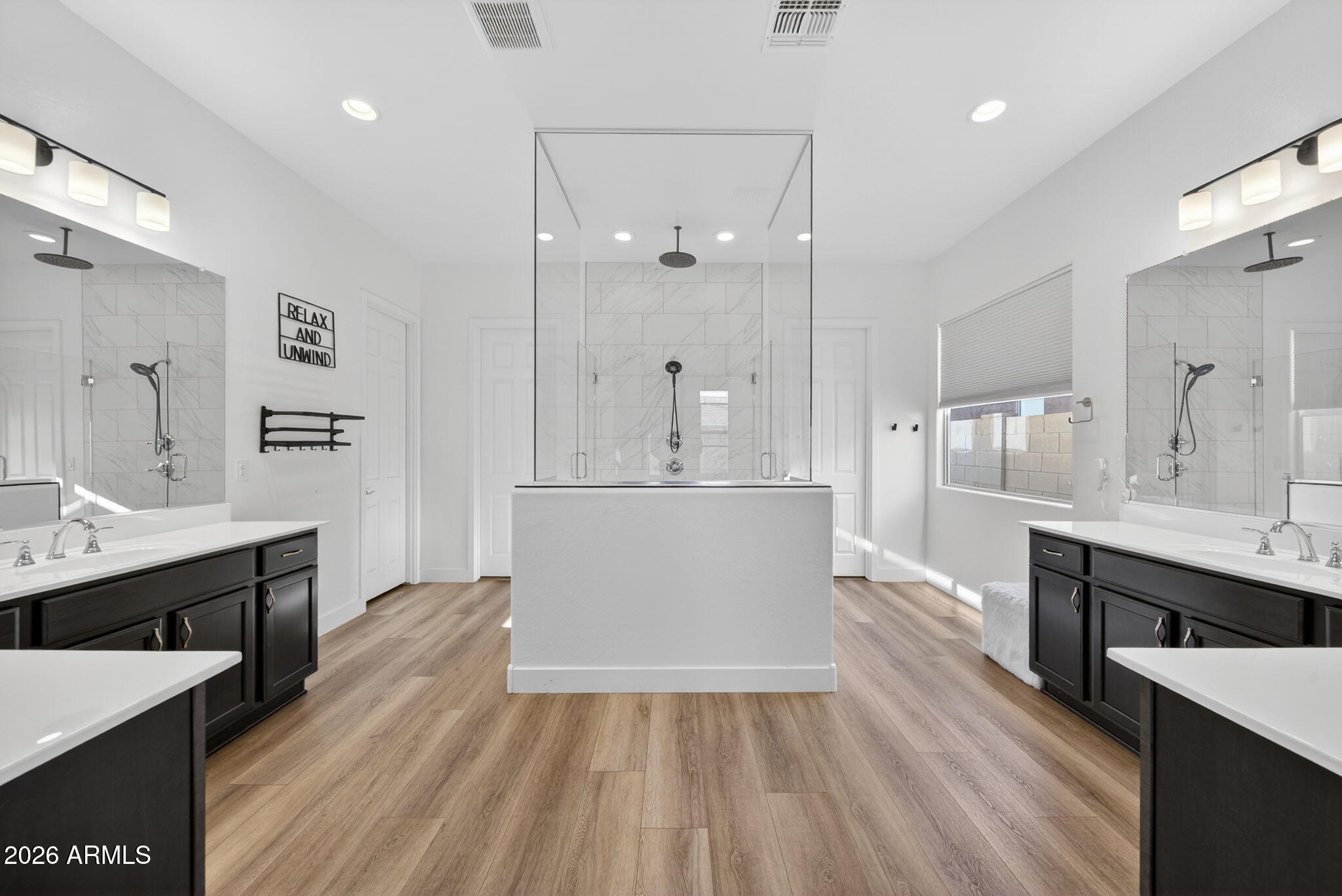9932 East Rotation Drive Mesa, AZ 85212 - Photo 25 of 62 a view of kitchen island with sink wooden floor and living room