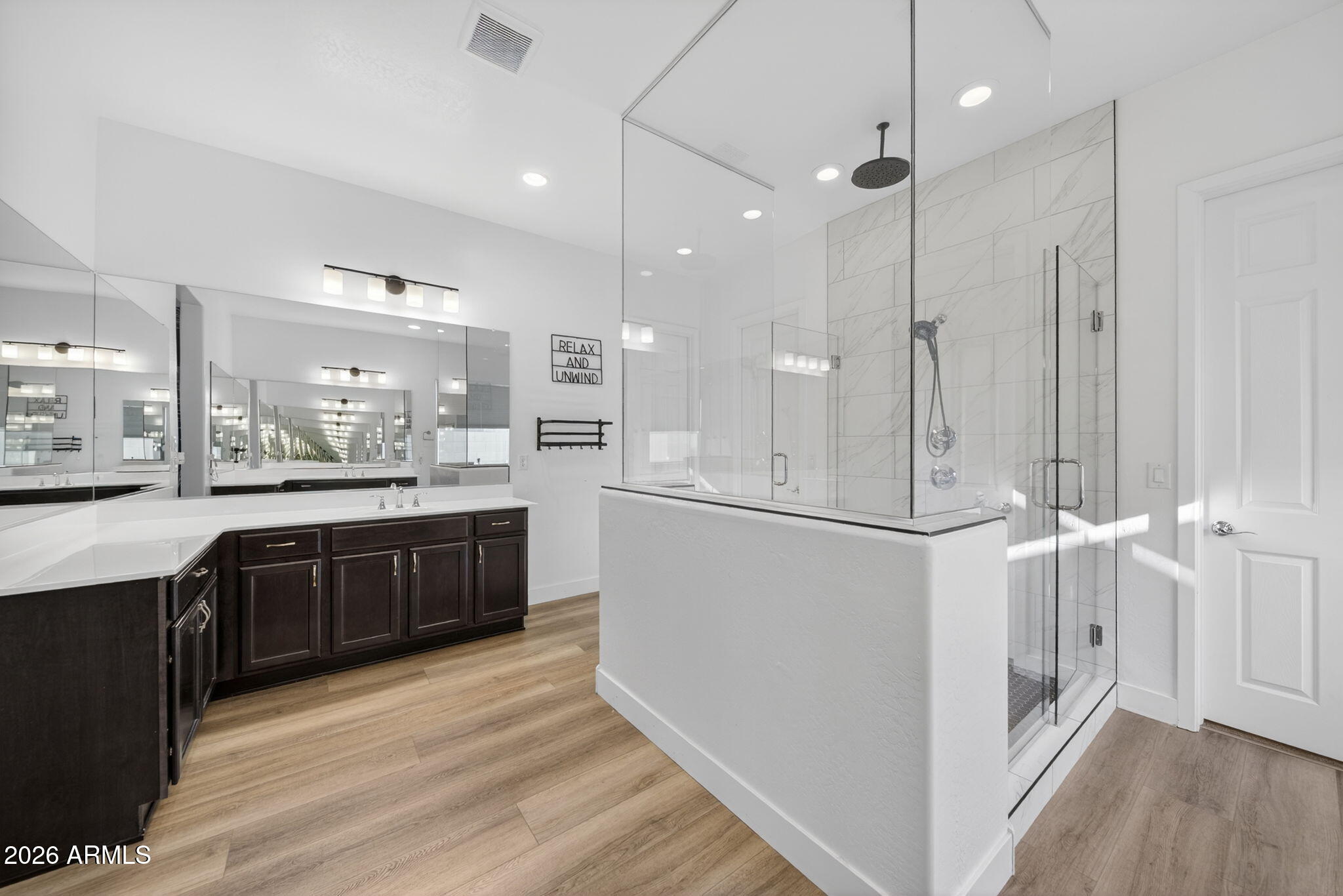 9932 East Rotation Drive Mesa, AZ 85212 - Photo 26 of 62 a large kitchen with a large counter top appliances and cabinets