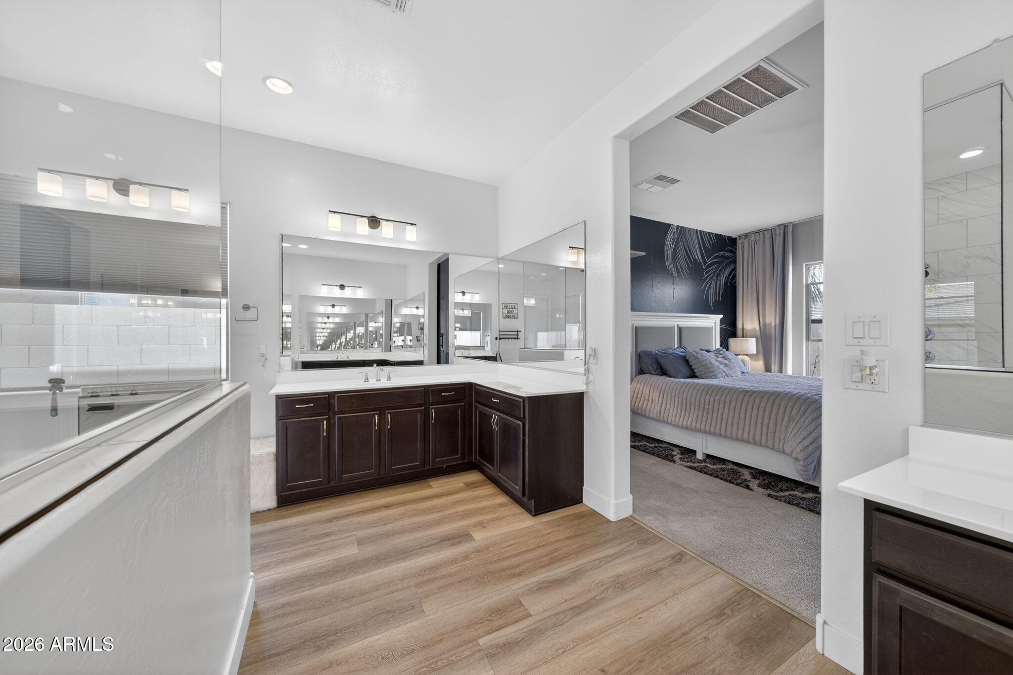9932 East Rotation Drive Mesa, AZ 85212 - Photo 27 of 62 a large kitchen with stainless steel appliances kitchen island granite countertop a large counter top and stainless steel appliances