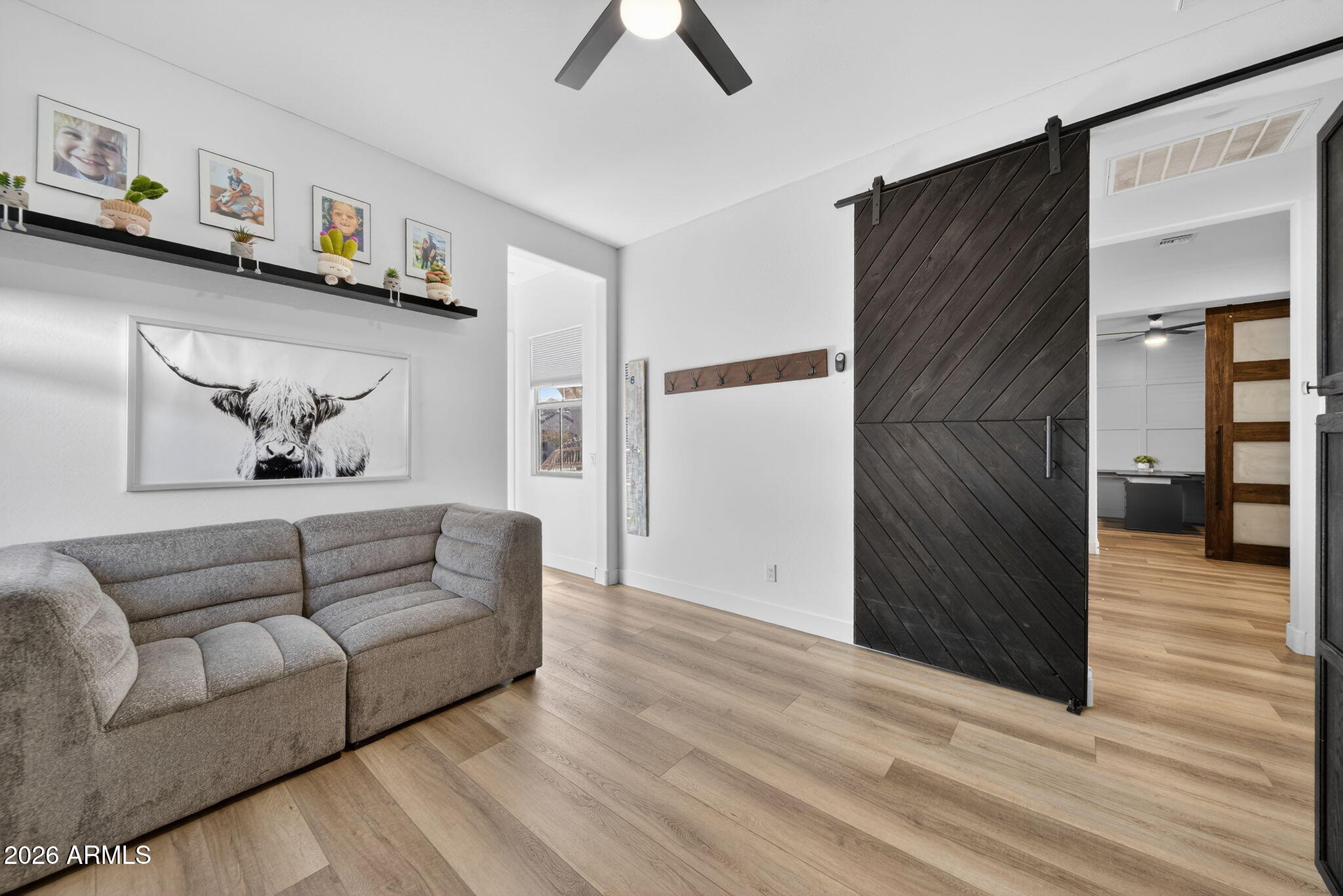 9932 East Rotation Drive Mesa, AZ 85212 - Photo 34 of 62 a living room with furniture and a wooden floor
