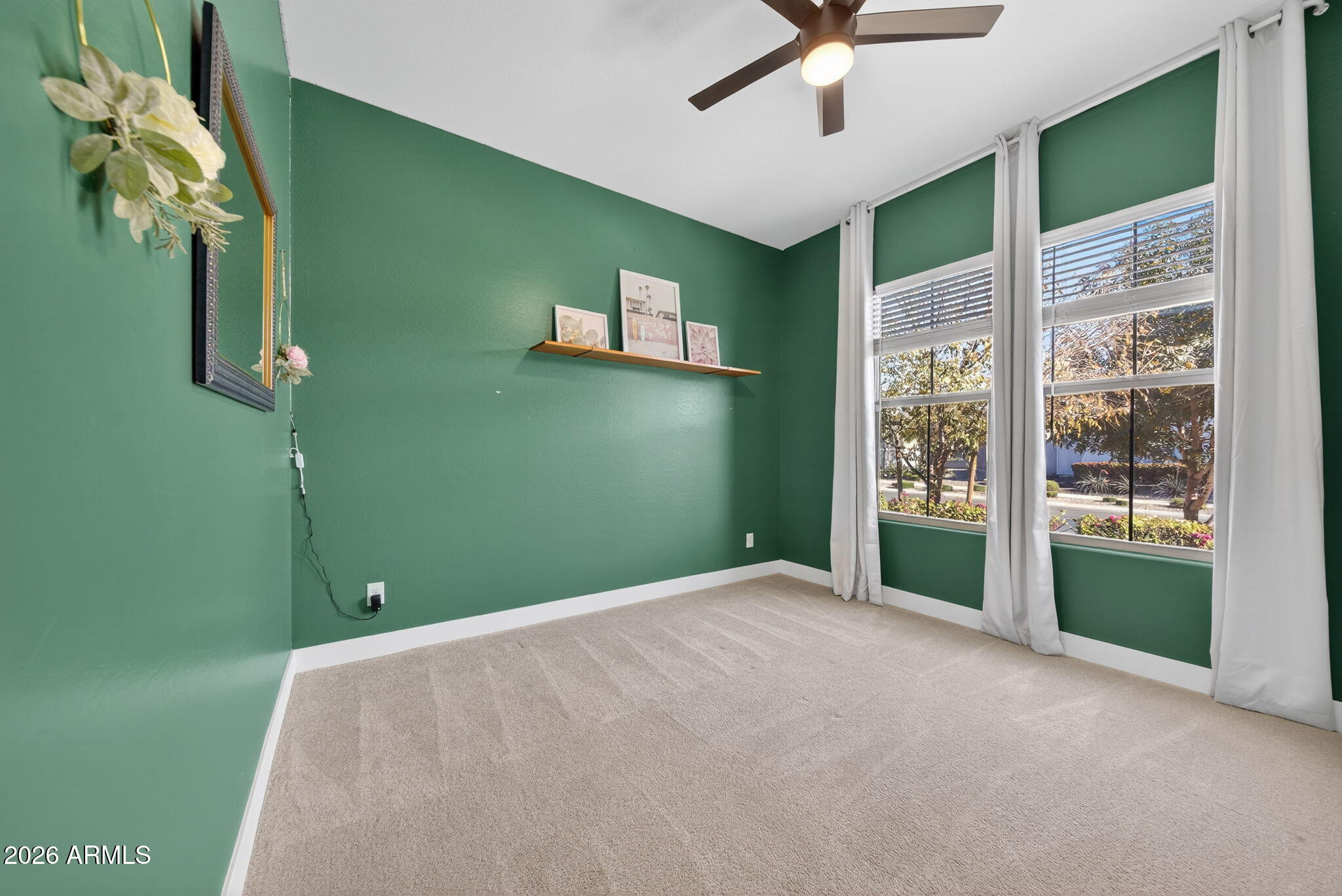 9932 East Rotation Drive Mesa, AZ 85212 - Photo 38 of 62 a view of a livingroom with a ceiling fan and window