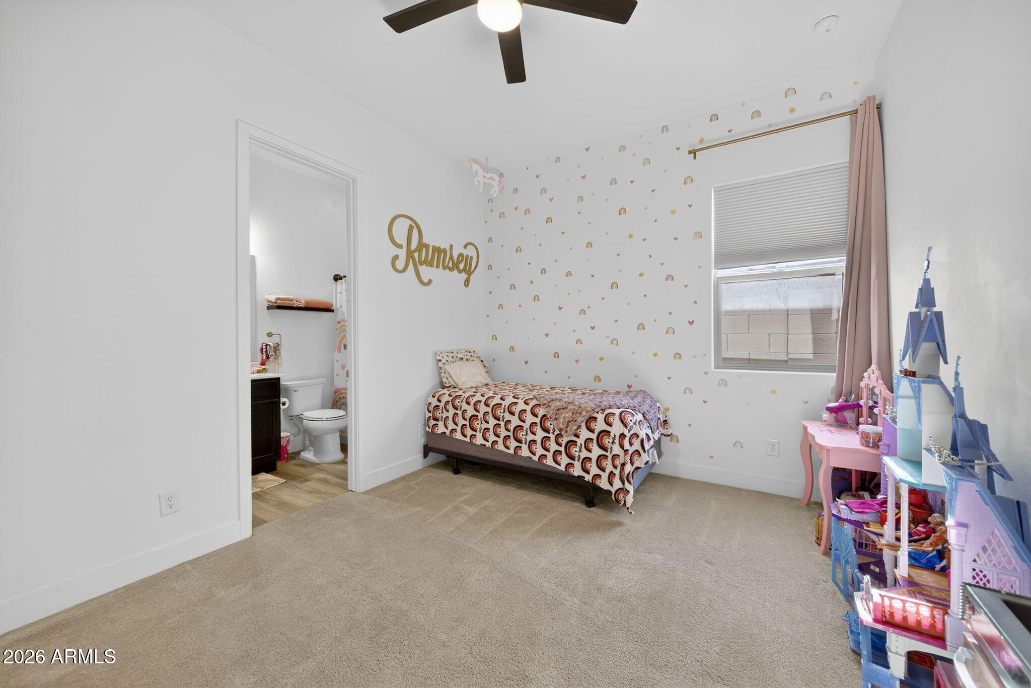 9932 East Rotation Drive Mesa, AZ 85212 - Photo 47 of 62 a bedroom with a bed and a chandelier