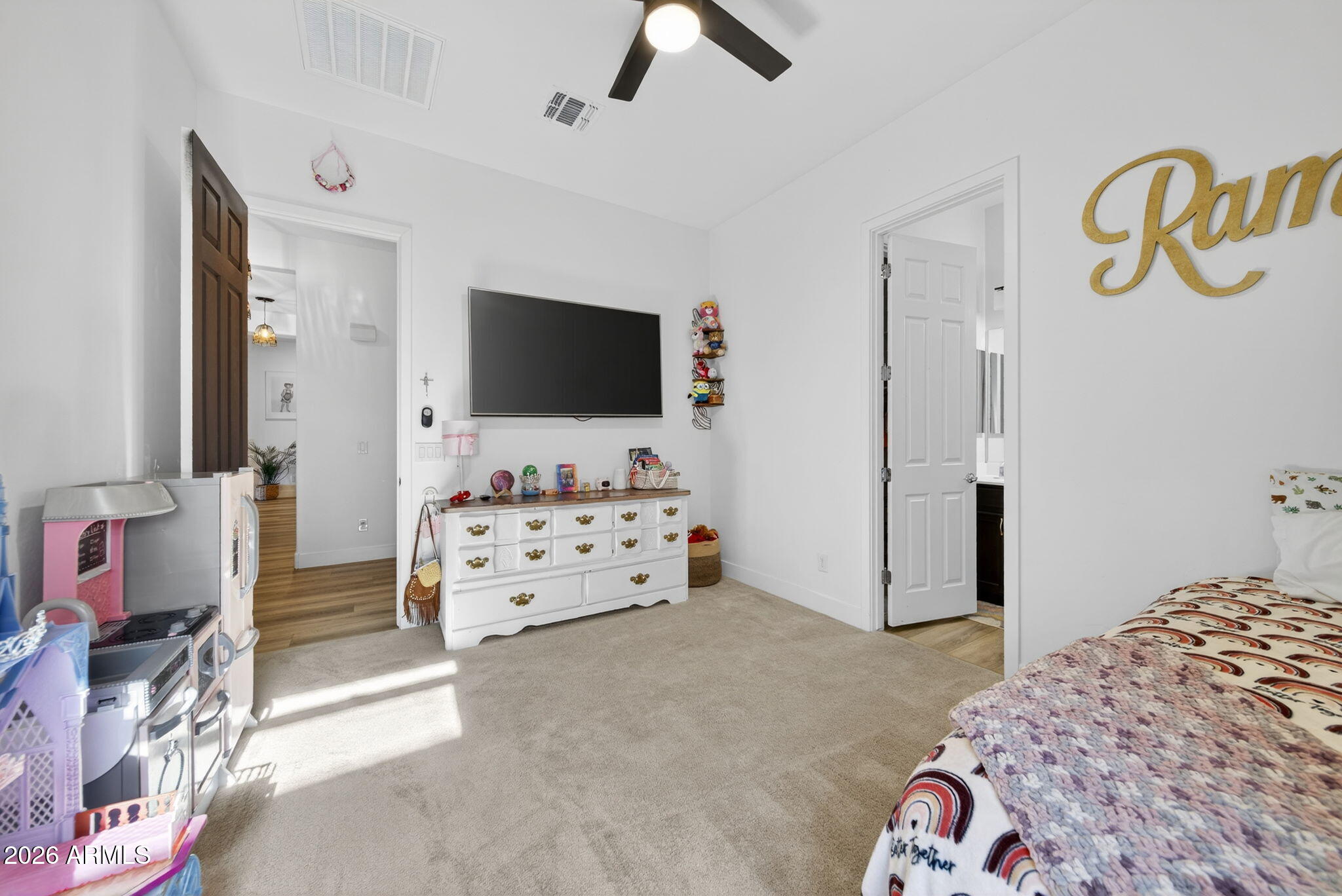 9932 East Rotation Drive Mesa, AZ 85212 - Photo 48 of 62 a bedroom with furniture and flat screen tv