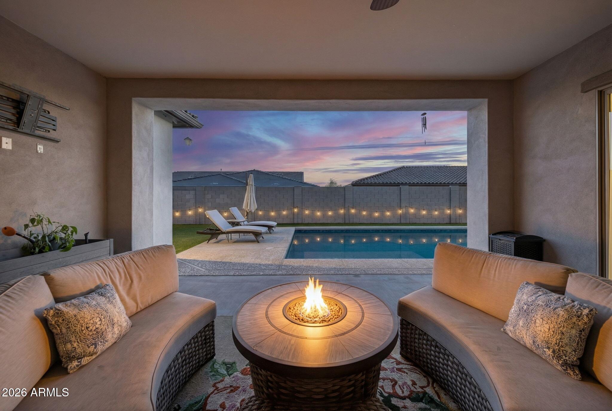 9932 East Rotation Drive Mesa, AZ 85212 - Photo 52 of 62 a living room with furniture and a large window