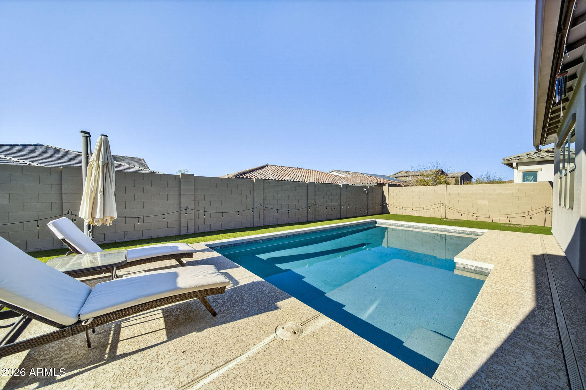 9932 East Rotation Drive Mesa, AZ 85212 - Photo 54 of 62 a couch sitting on top of a wooden floor