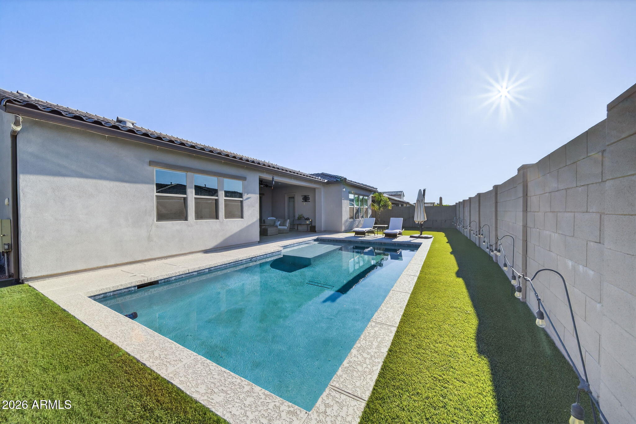 9932 East Rotation Drive Mesa, AZ 85212 - Photo 56 of 62 a swimming pool with outdoor seating and yard