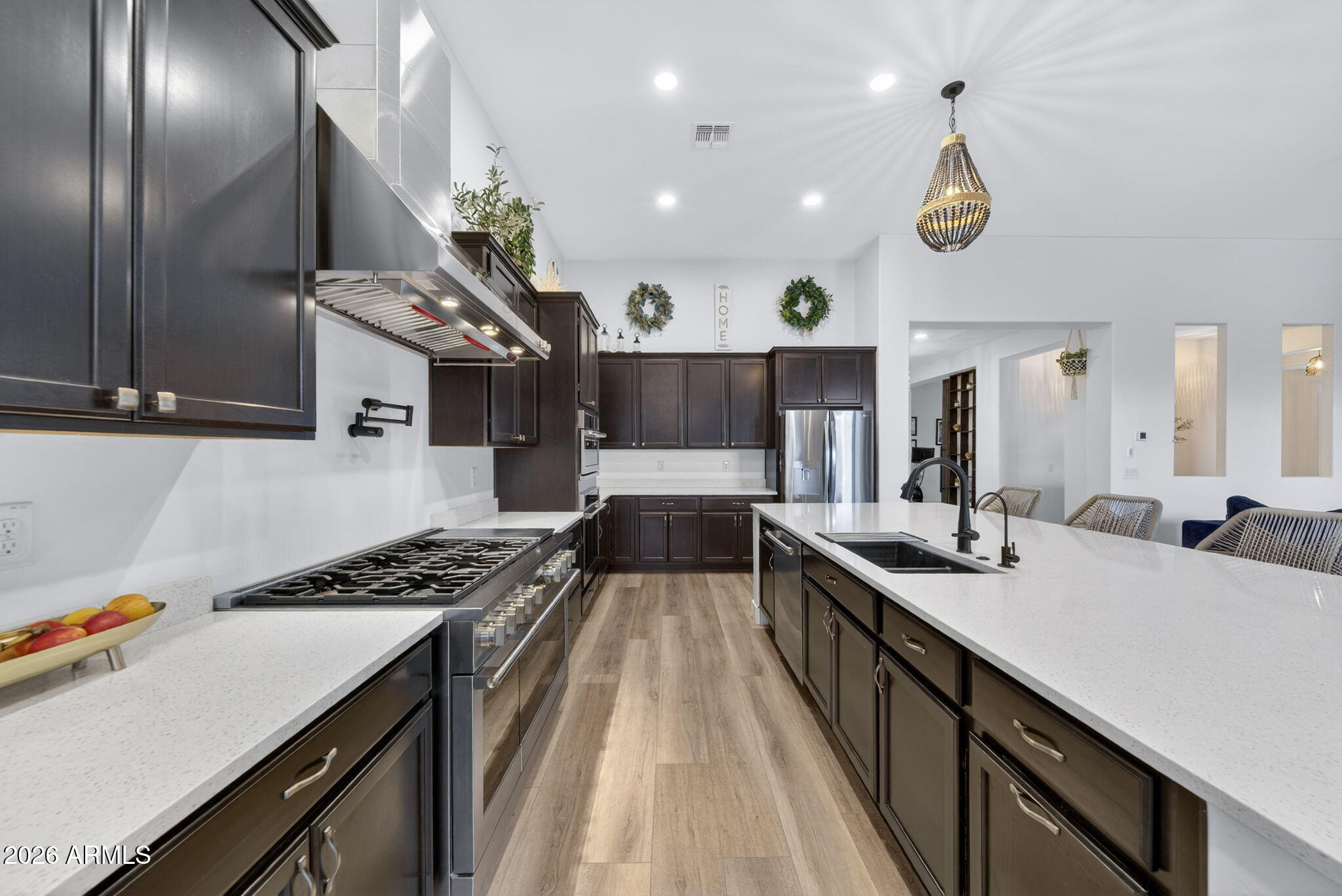 9932 East Rotation Drive Mesa, AZ 85212 - Photo 9 of 62 a kitchen with a sink stove and cabinets