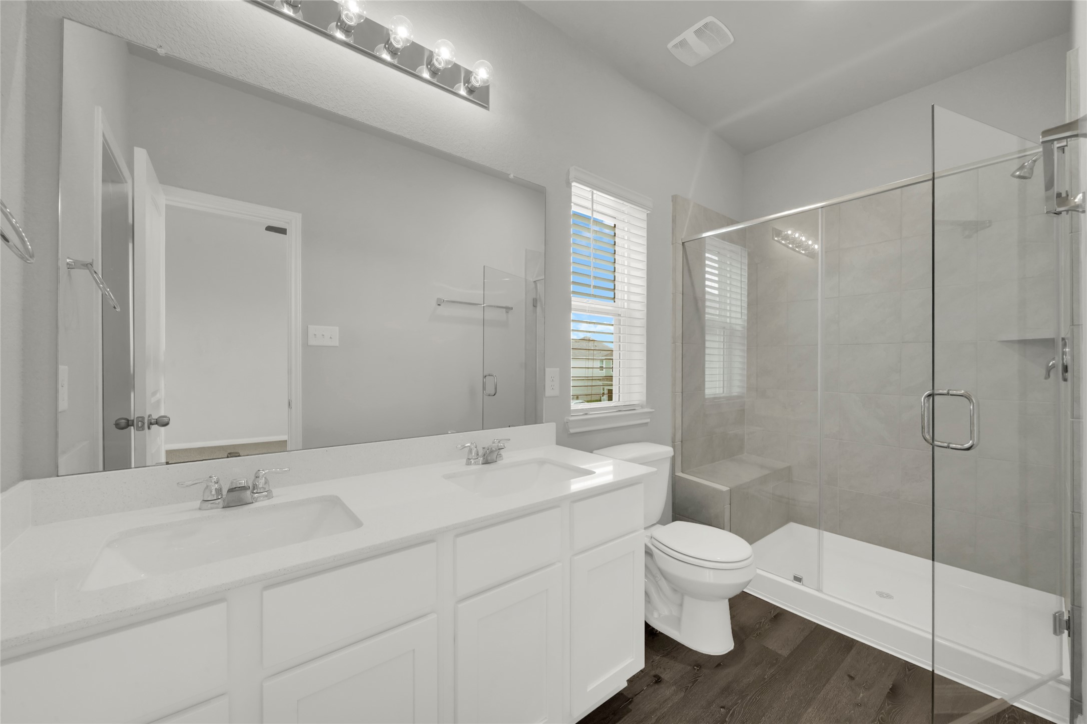 2542 Steelhead Drive Conroe, TX 77384 - Photo 15 of 20 The primary bath features a dual sink vanity and lower cabinet storage.