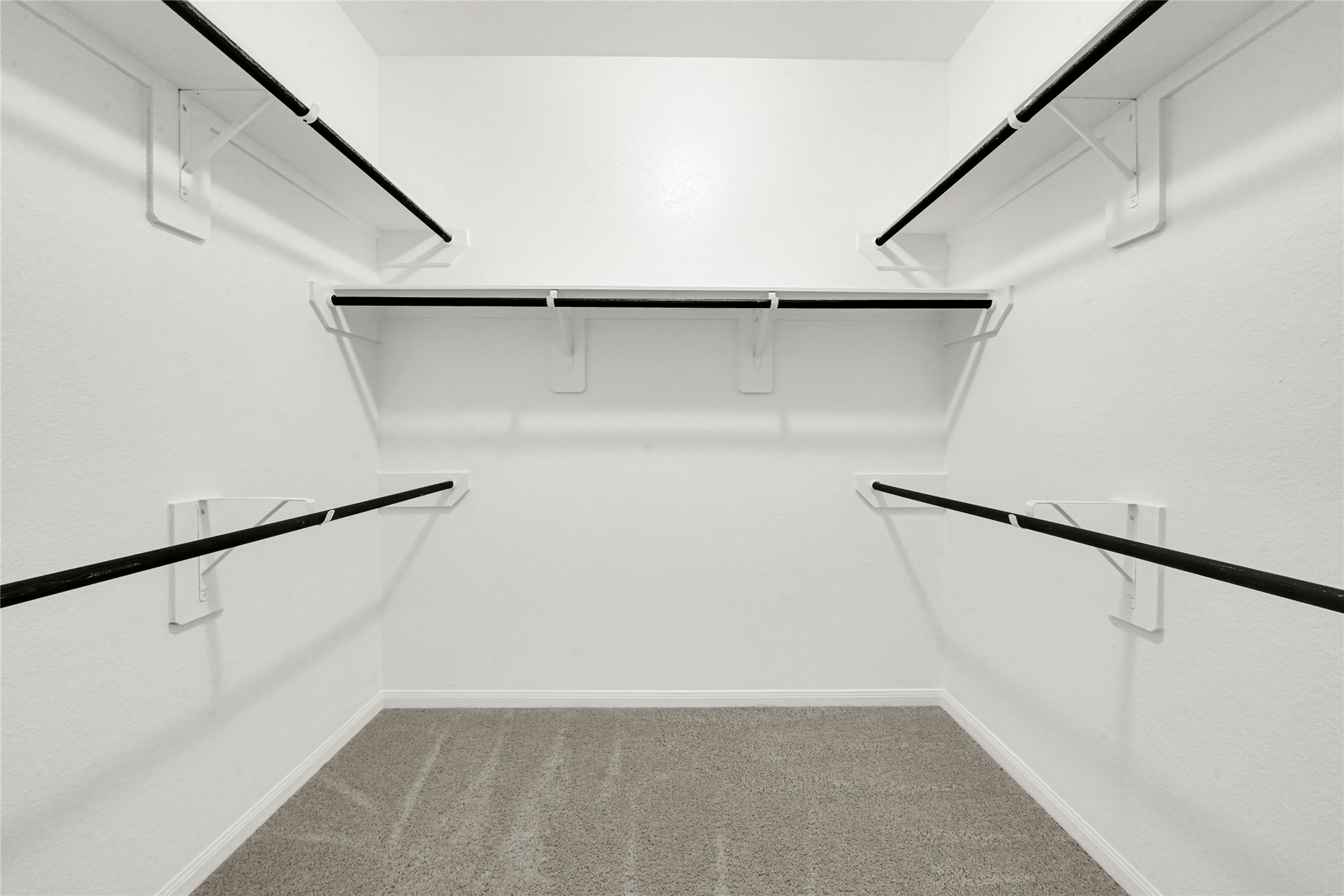 2542 Steelhead Drive Conroe, TX 77384 - Photo 17 of 20 Take a look at the spacious walk-in closet with plenty of areas for all of your hanging clothes.