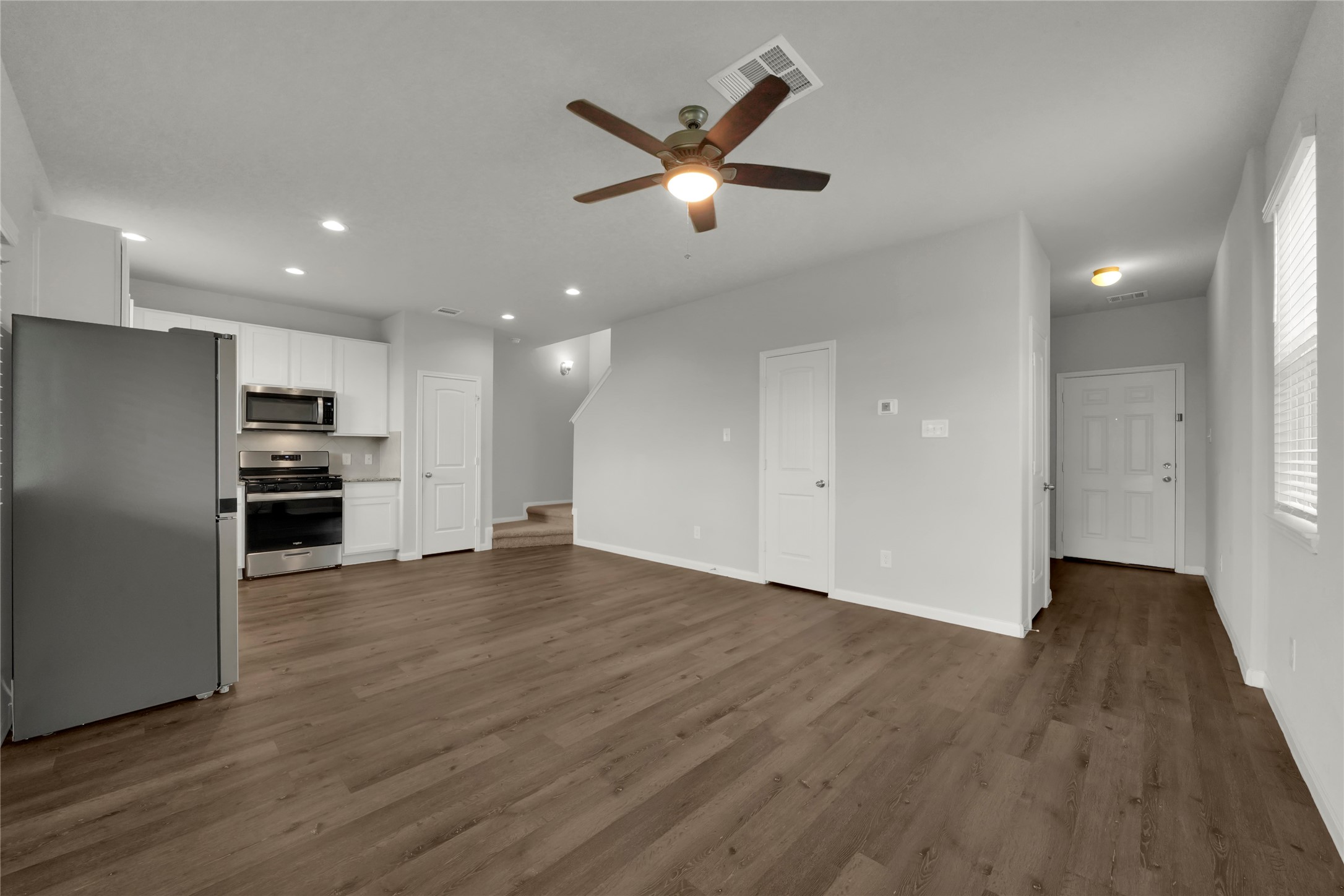 2542 Steelhead Drive Conroe, TX 77384 - Photo 3 of 20 This view allows you to see the flexible design of the living room and dining room as they join the kitchen.