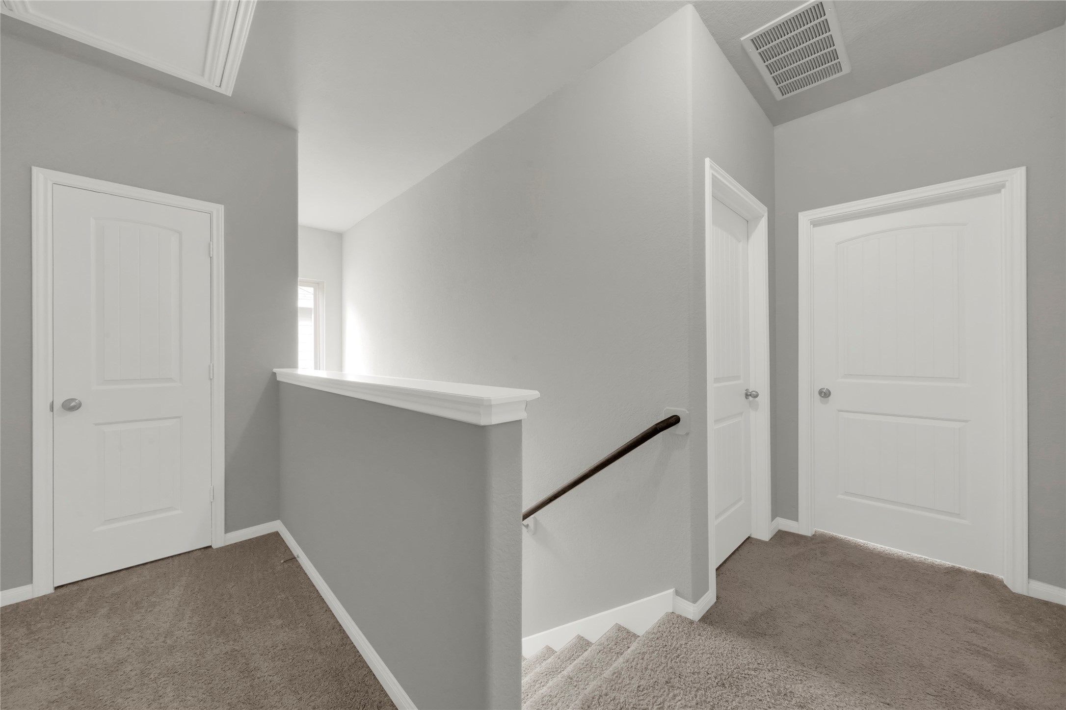 2542 Steelhead Drive Conroe, TX 77384 - Photo 8 of 20 At the top of the stairs you'll notice the two secondary bedrooms to your left.