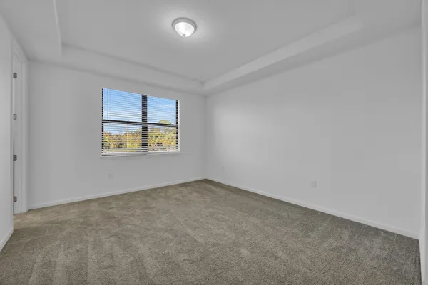 an empty room with a bathroom