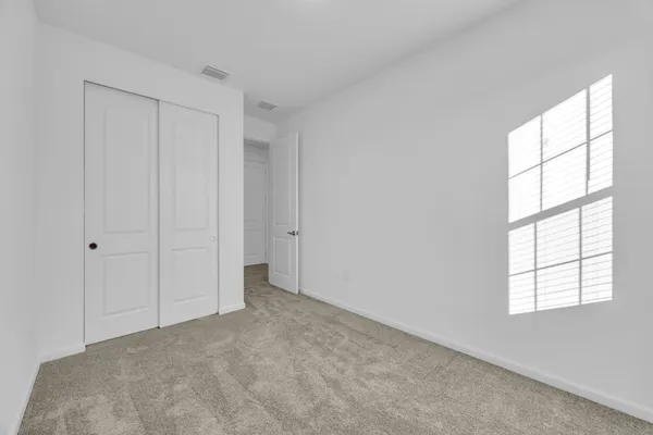 a view of empty room with windows