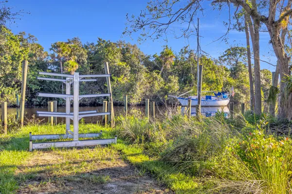 a view of a lake with a house in the background