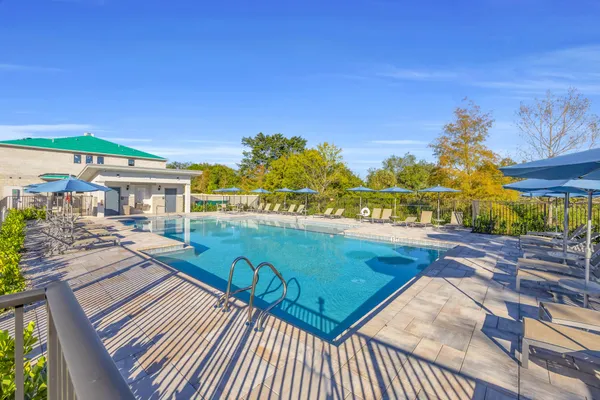 a view of a balcony with chair and wooden floor
