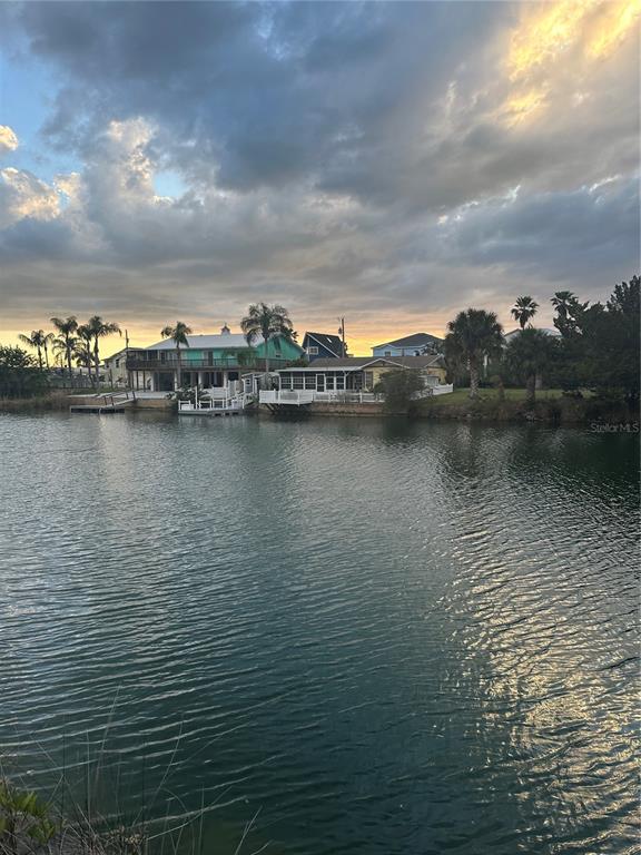 3377 Oleander Drive Hernando Beach, FL 34607 - Photo 12 of 22 a view of a lake with boats in front of house